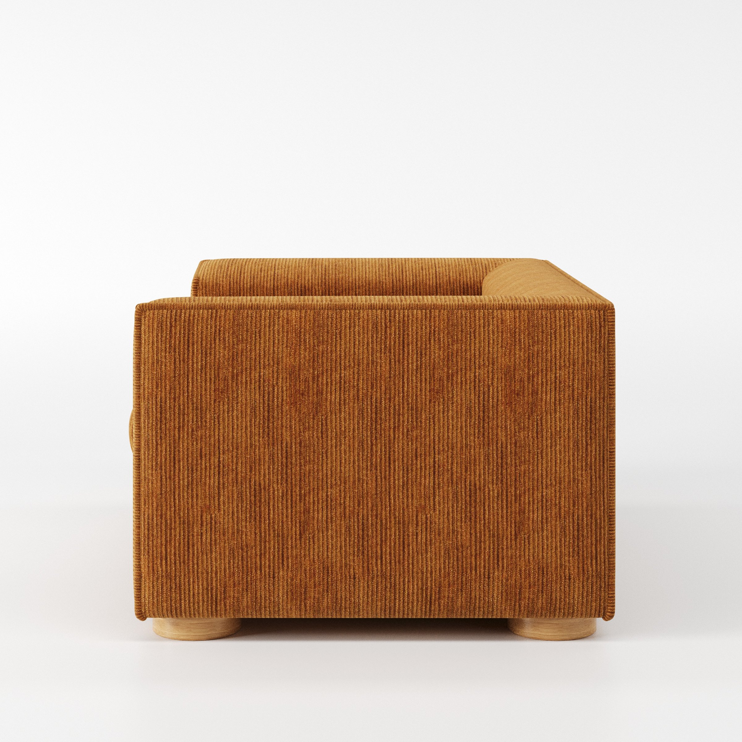 Feale armchair in Caldey Velvet Corduroy Tobacco shown in side profile displaying proportions and overall silhouette.
