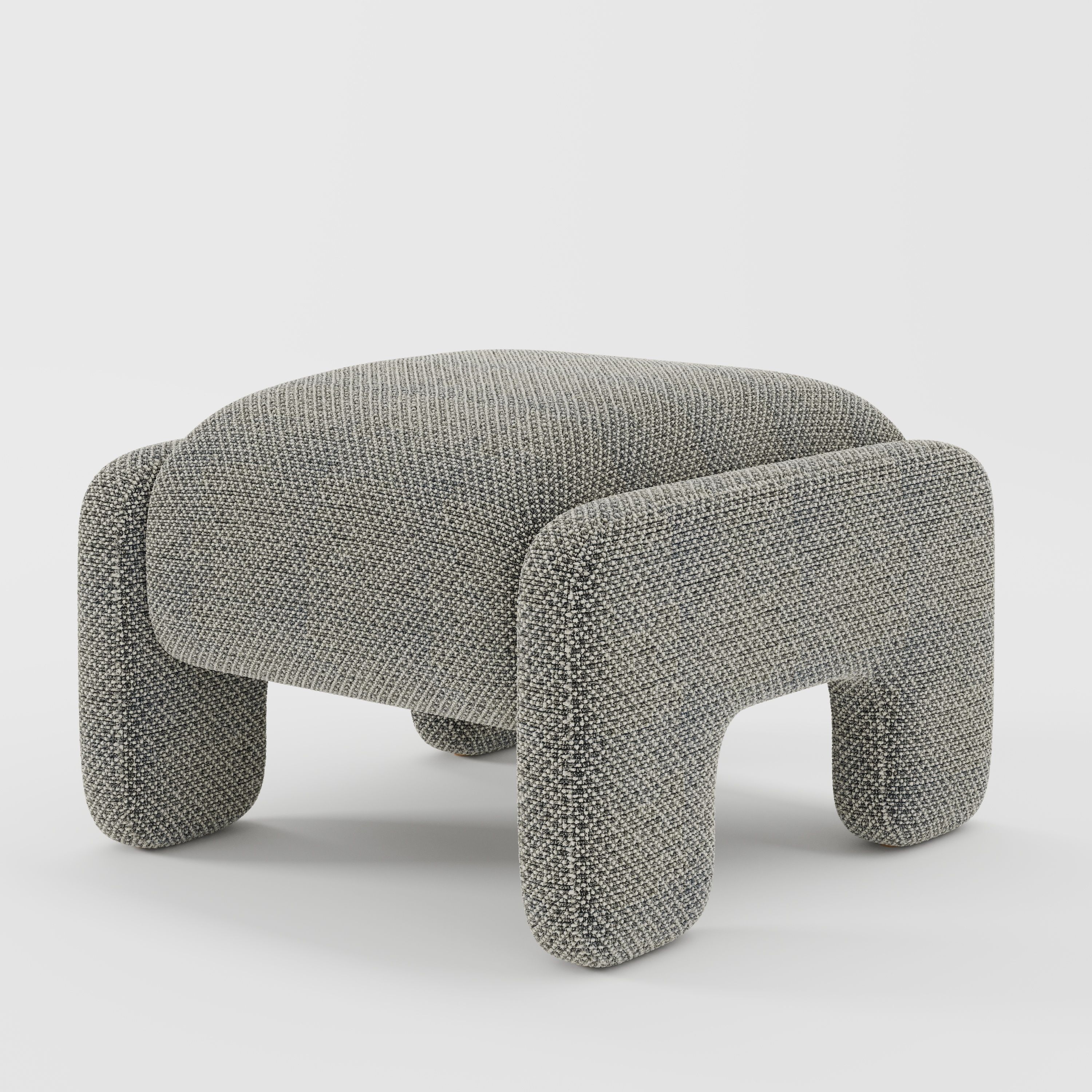 Inny footstool in Rousay wool blend tar and chalk fabric, diagonal view highlighting structured silhouette and subtle contrast weave