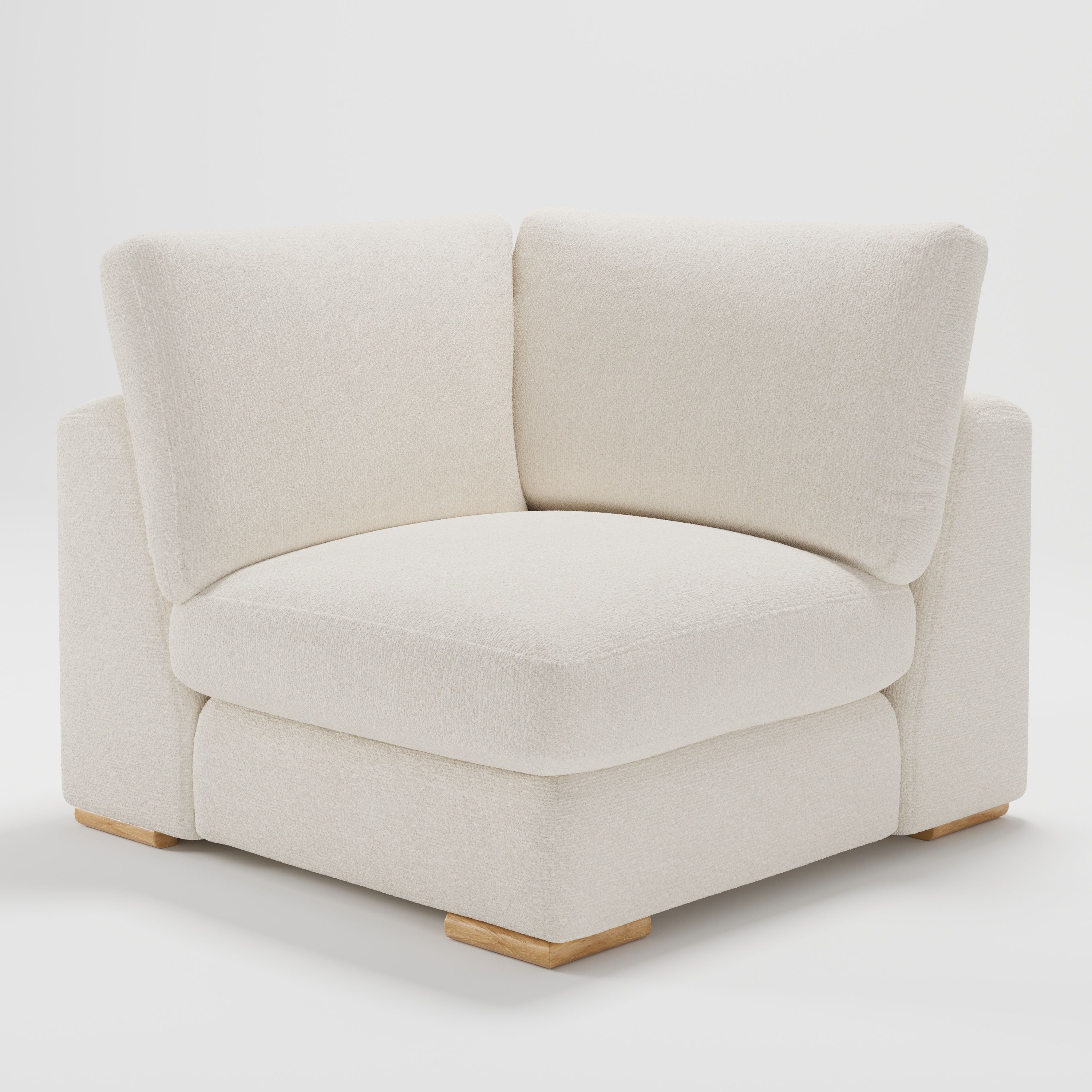 Olton corner unit in Kilda bouclé cream fabric, diagonal view highlighting soft curves and textured finish