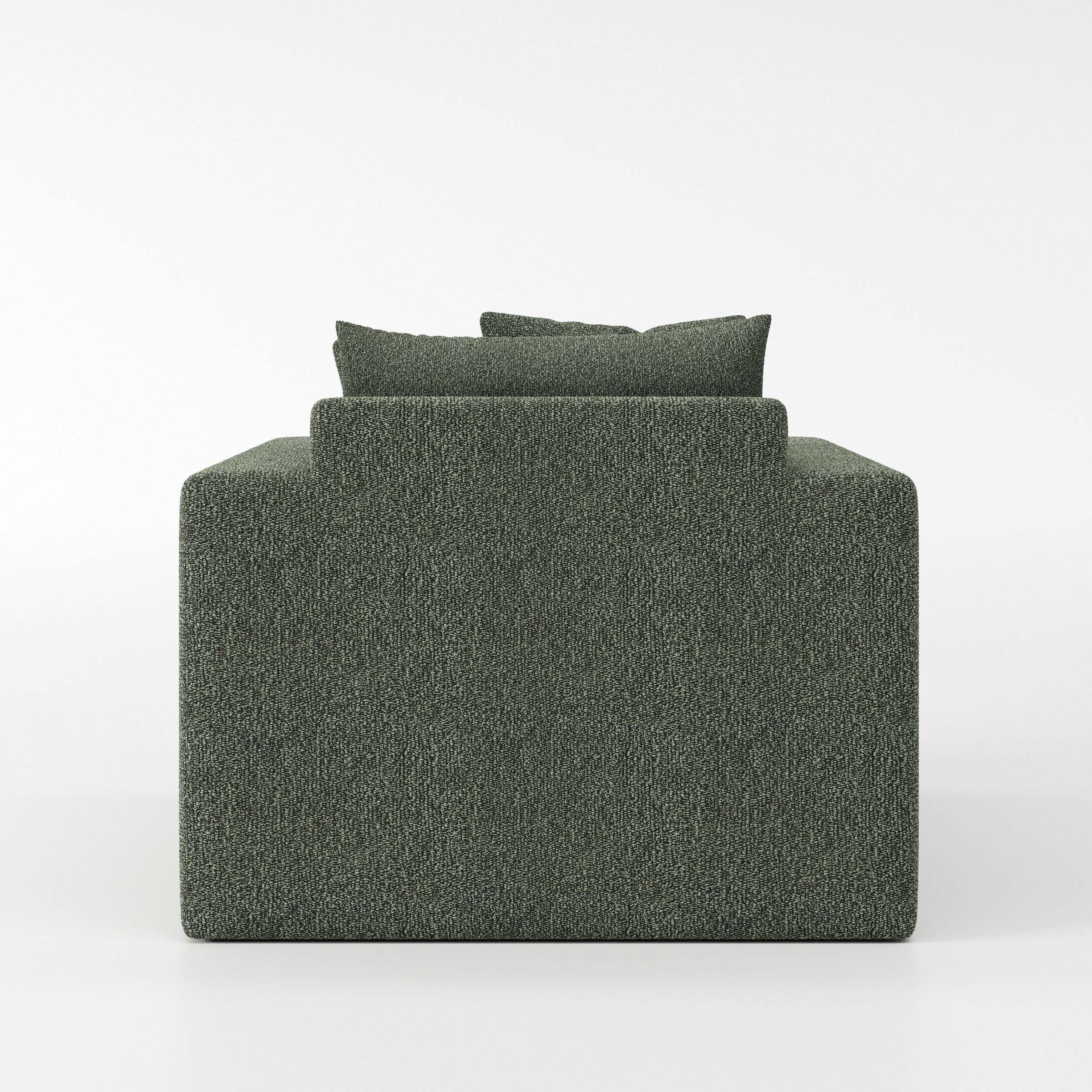Coniston armchair in Kilda Boucle Moss shown from the rear highlighting backrest shape and upholstery finish.