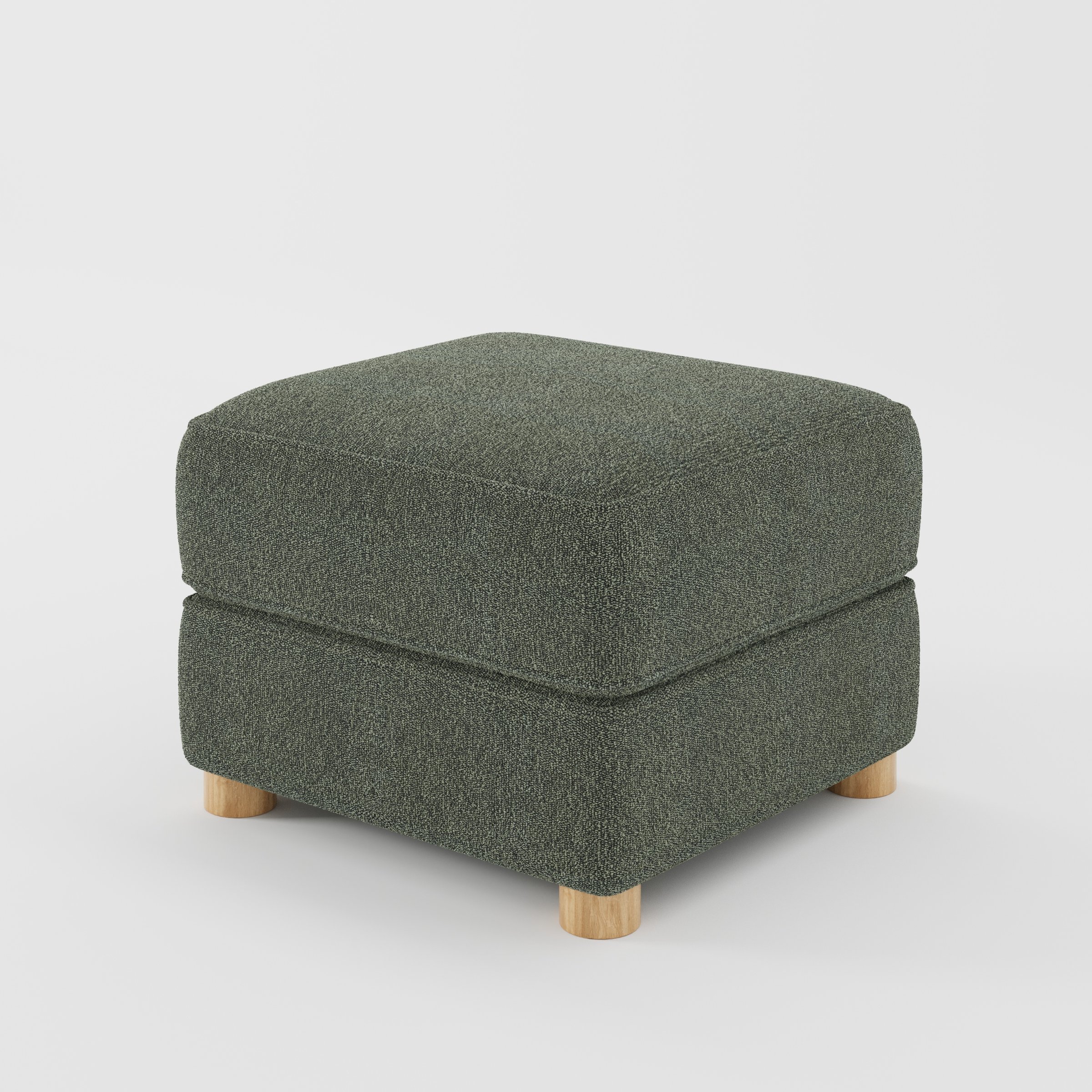 Fergus footstool in Kilda Boucle Moss shown at a diagonal angle highlighting compact proportions and rounded wooden feet.