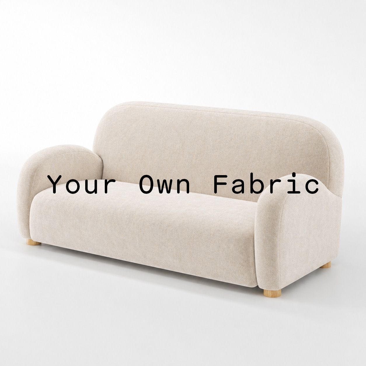 Diagonal view of the Awe sofa upholstered in customers own material calico cotton fabric.