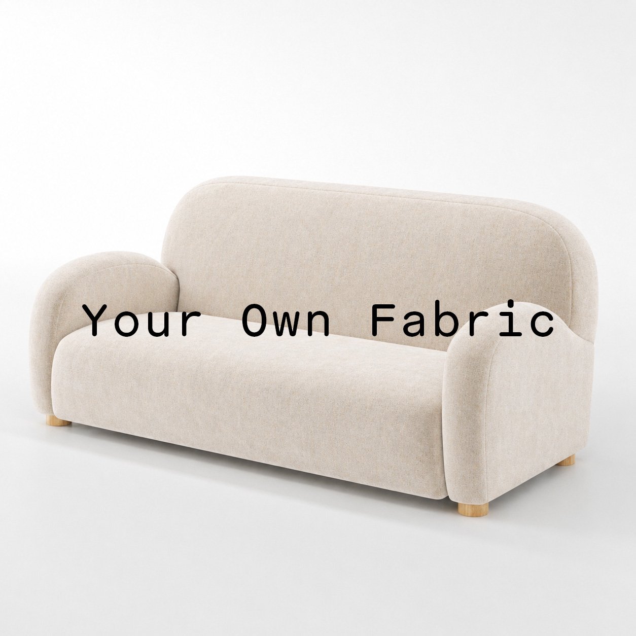Diagonal view of the Awe sofa upholstered in customers own material calico cotton fabric.