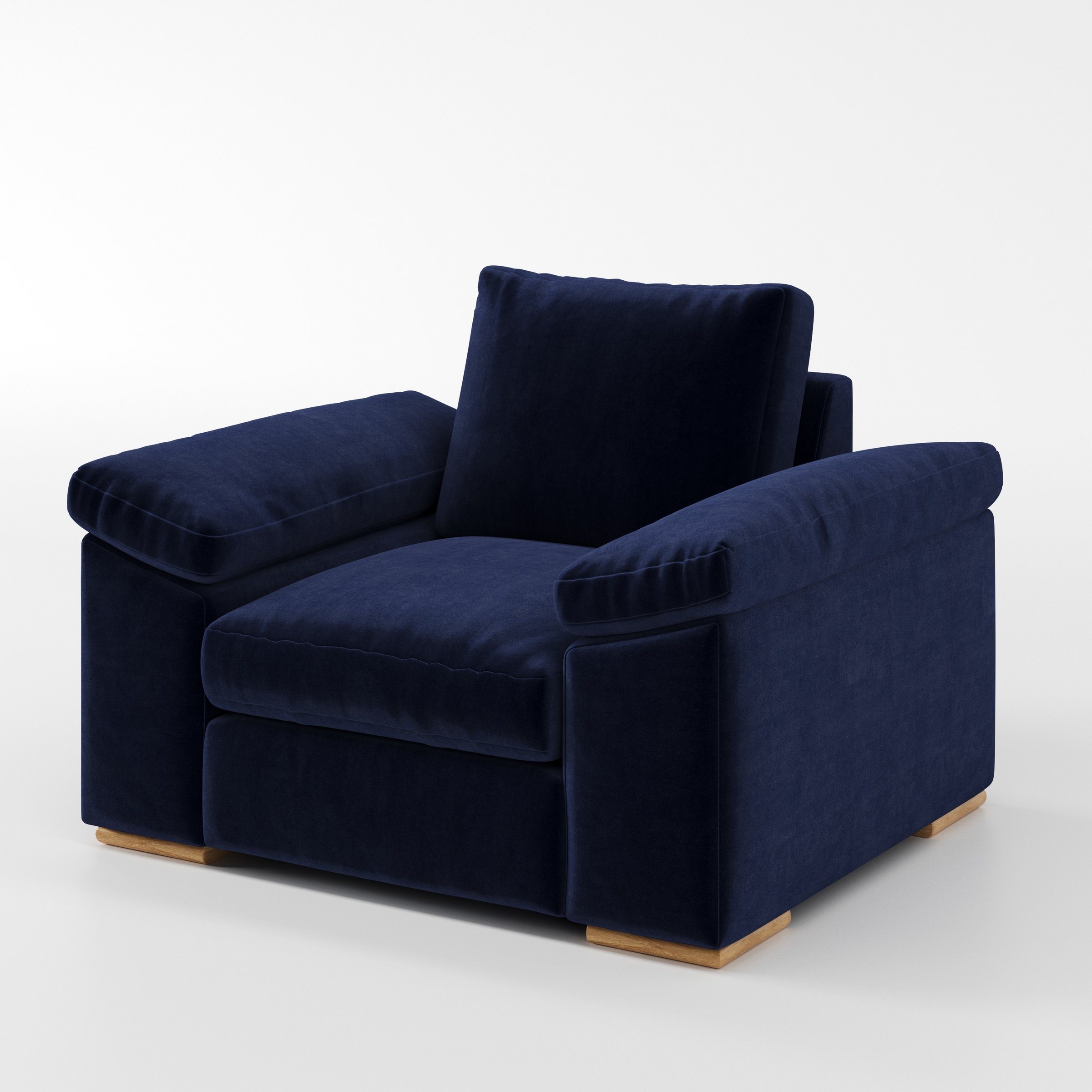 Moy armchair in Noss Velvet Navy shown at a diagonal angle highlighting arms and seat depth.