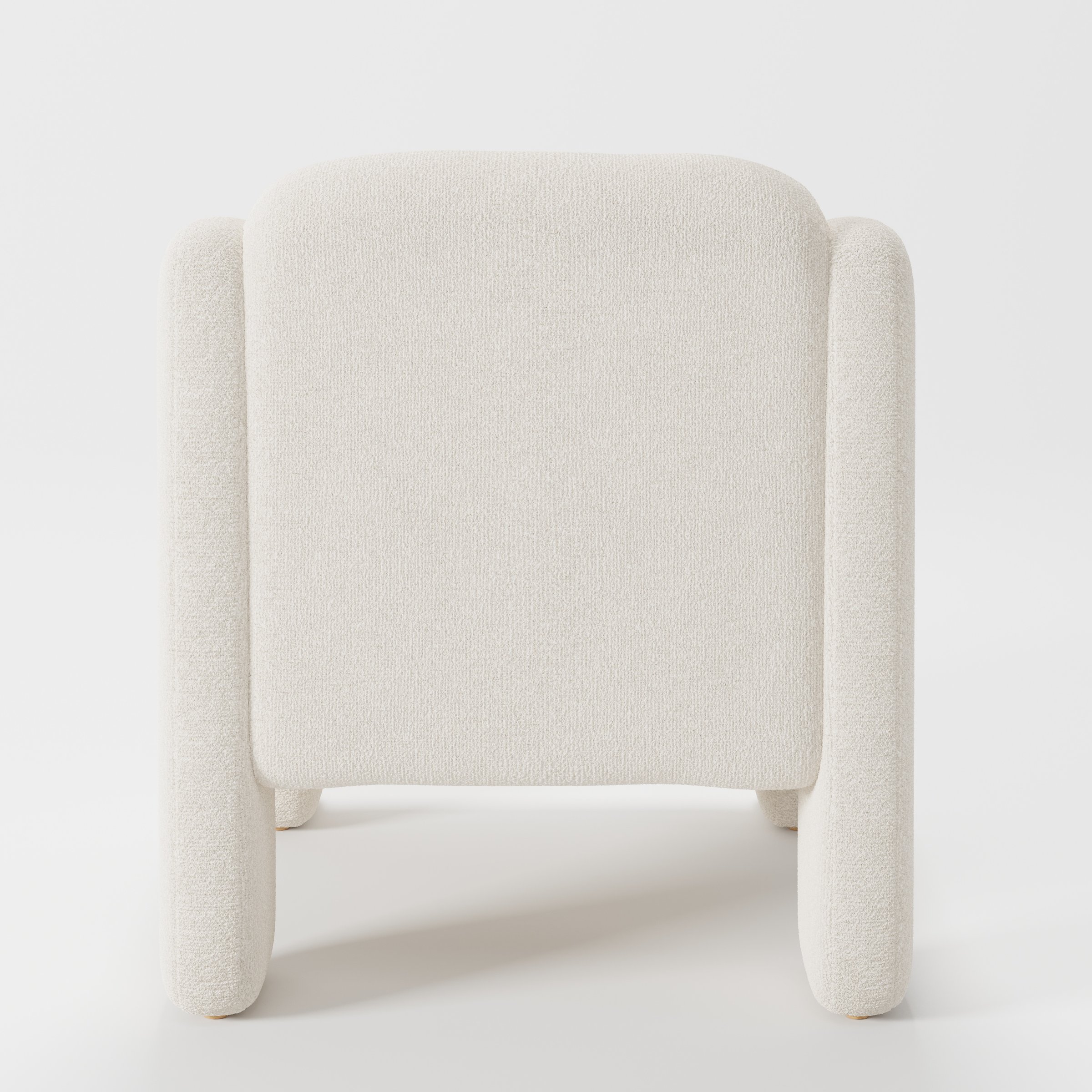 Inny armchair in Kilda Boucle Cream shown from the rear highlighting curved backrest and upholstery finish.
