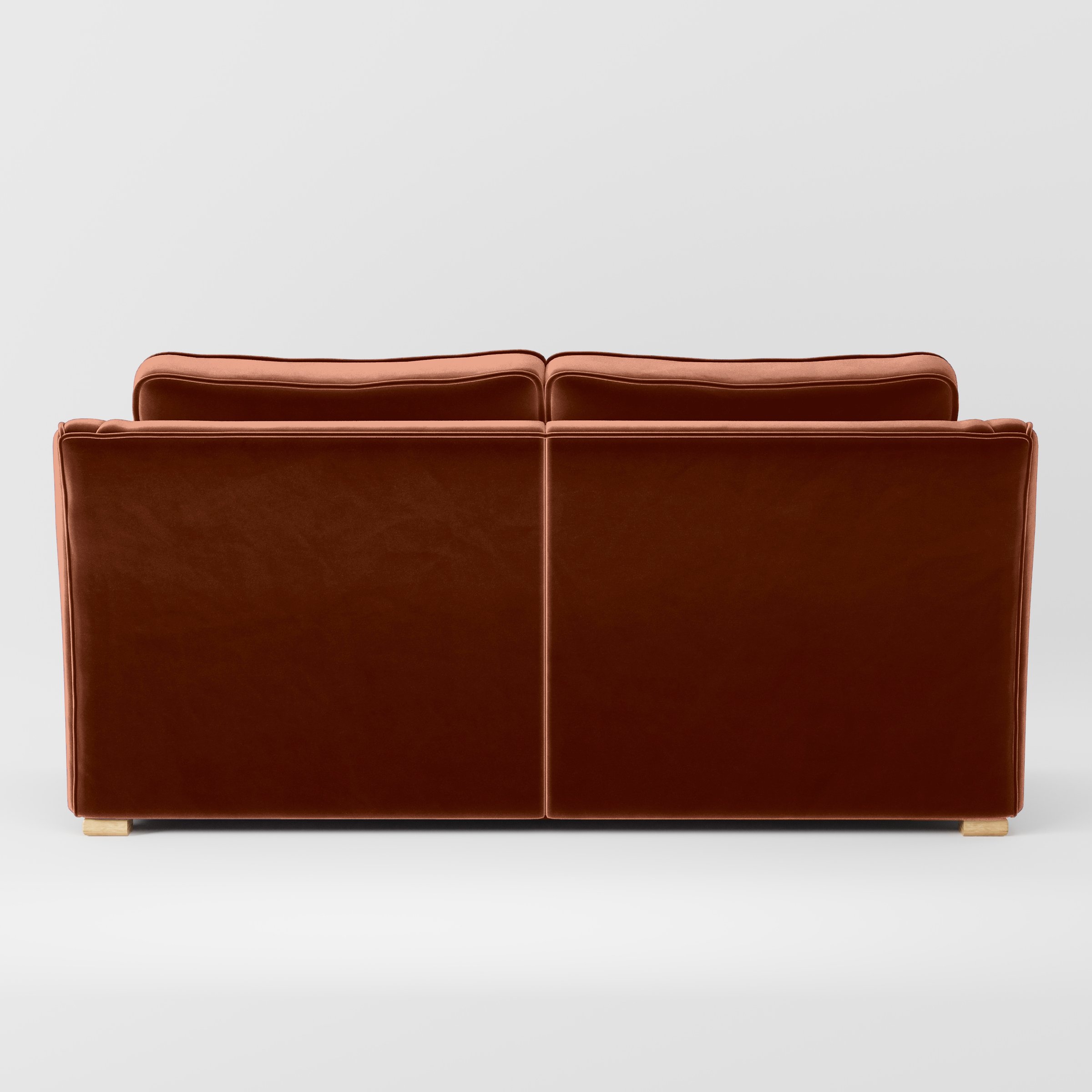 Rear view of the Cashel sofa upholstered in Plush EasyClean Velvet in Apricot.