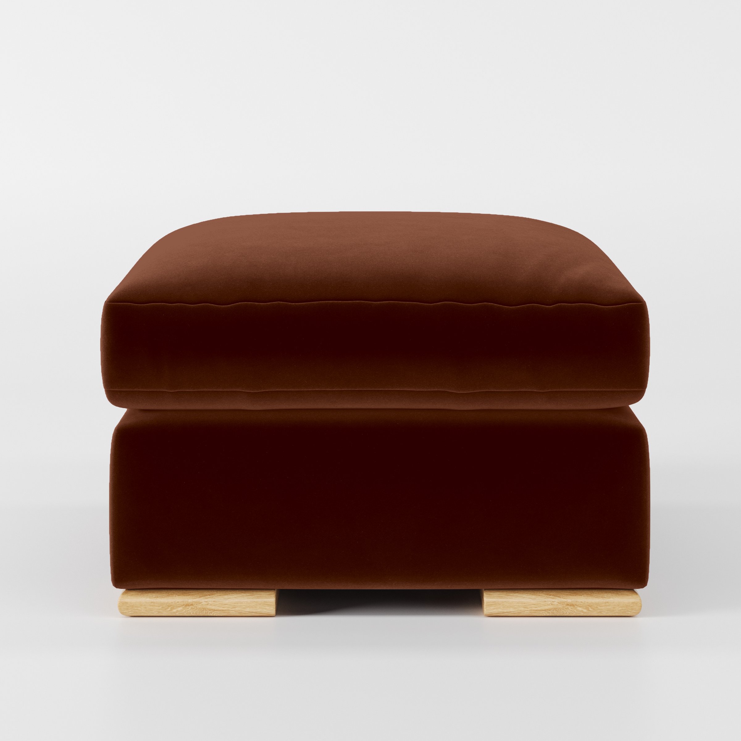 Front view of the Fane footstool upholstered in Plush EasyClean Velvet in Maple.