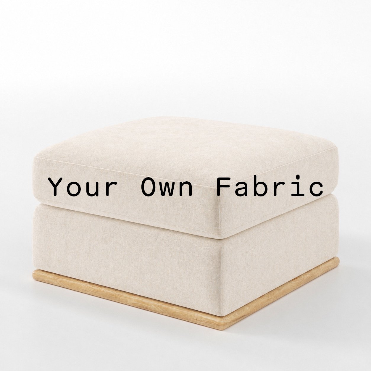 Diagonal view of the Cusher footstool upholstered in customers own material calico cotton fabric.
