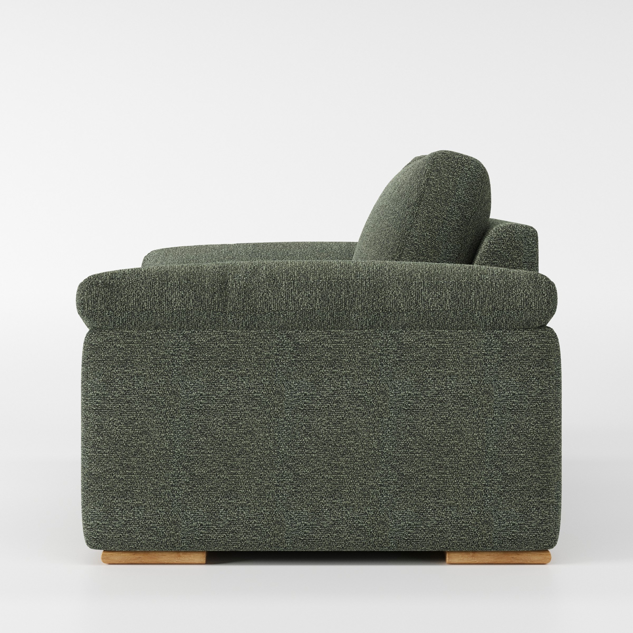 Moy armchair in Kilda Boucle Moss shown in side profile displaying proportions and overall silhouette.