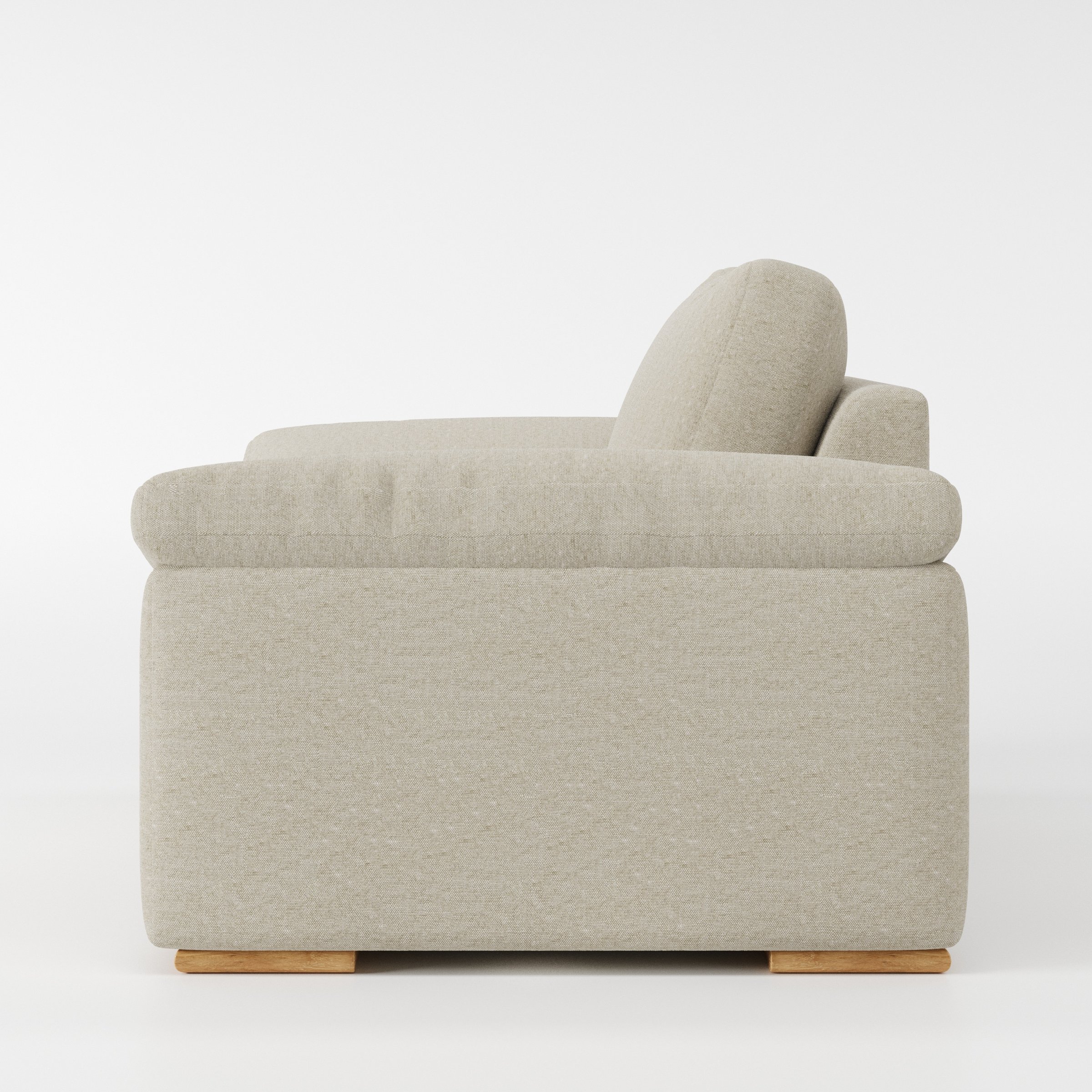 Moy armchair in Alderney Linen Oatmeal shown in side profile displaying proportions and overall silhouette.