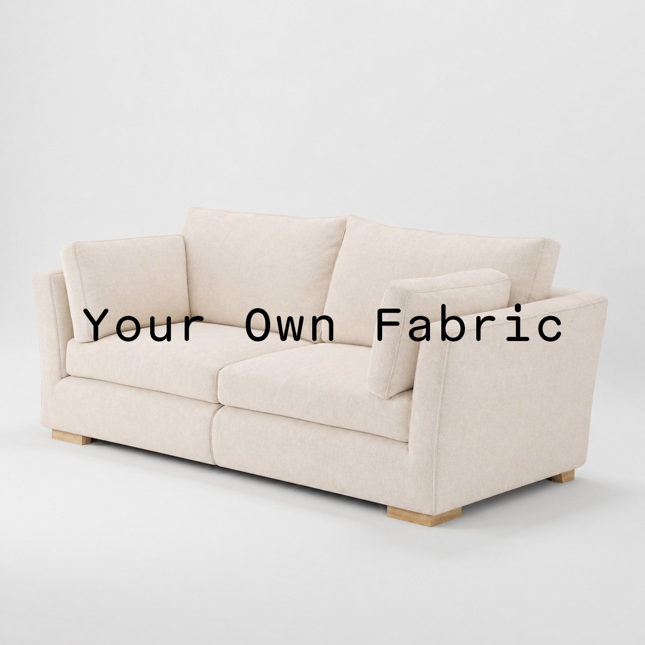 Diagonal view of the Stowe sofa upholstered in customers own material calico cotton fabric.