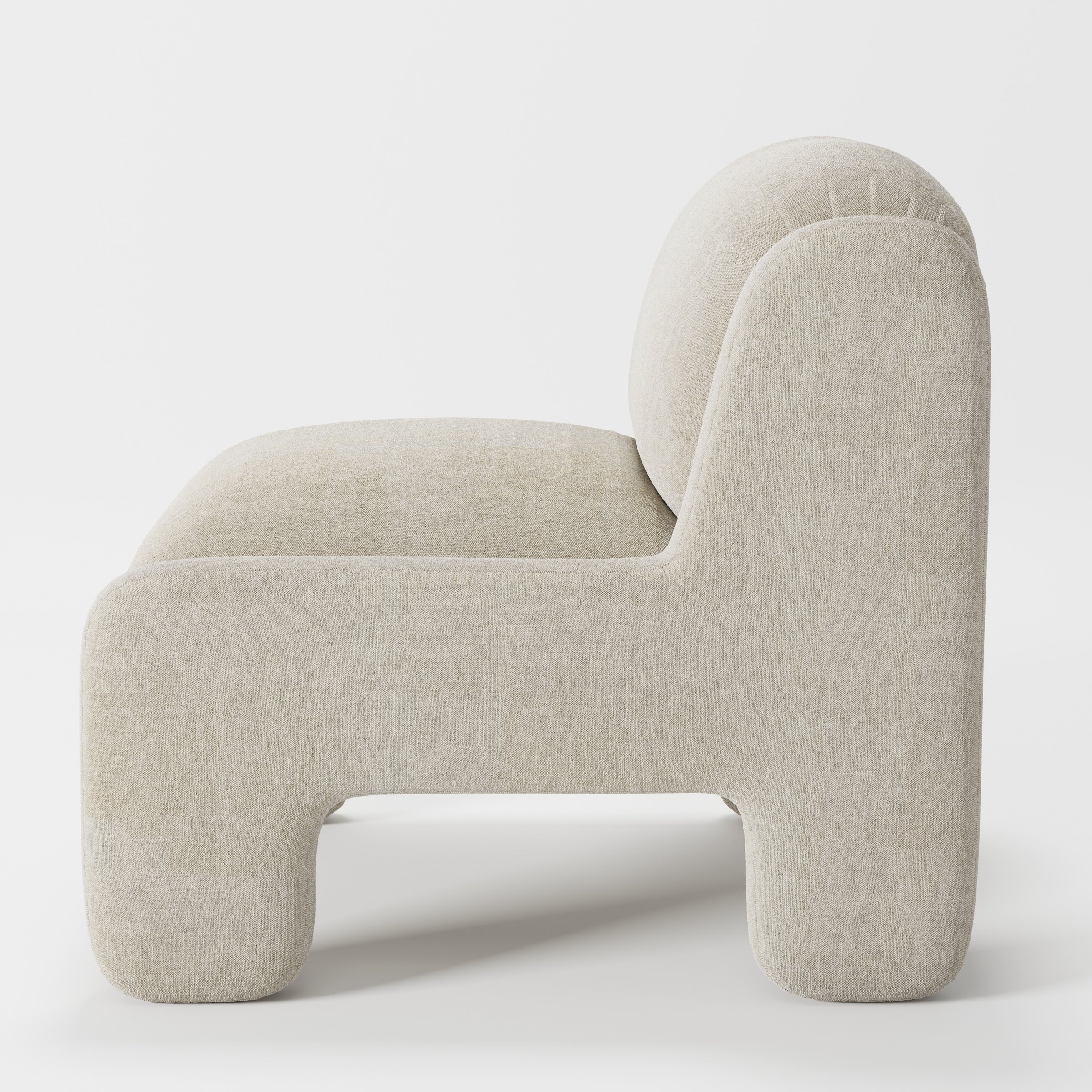 Inny armchair in Alderney Linen Oatmeal shown in side profile displaying proportions and overall silhouette.