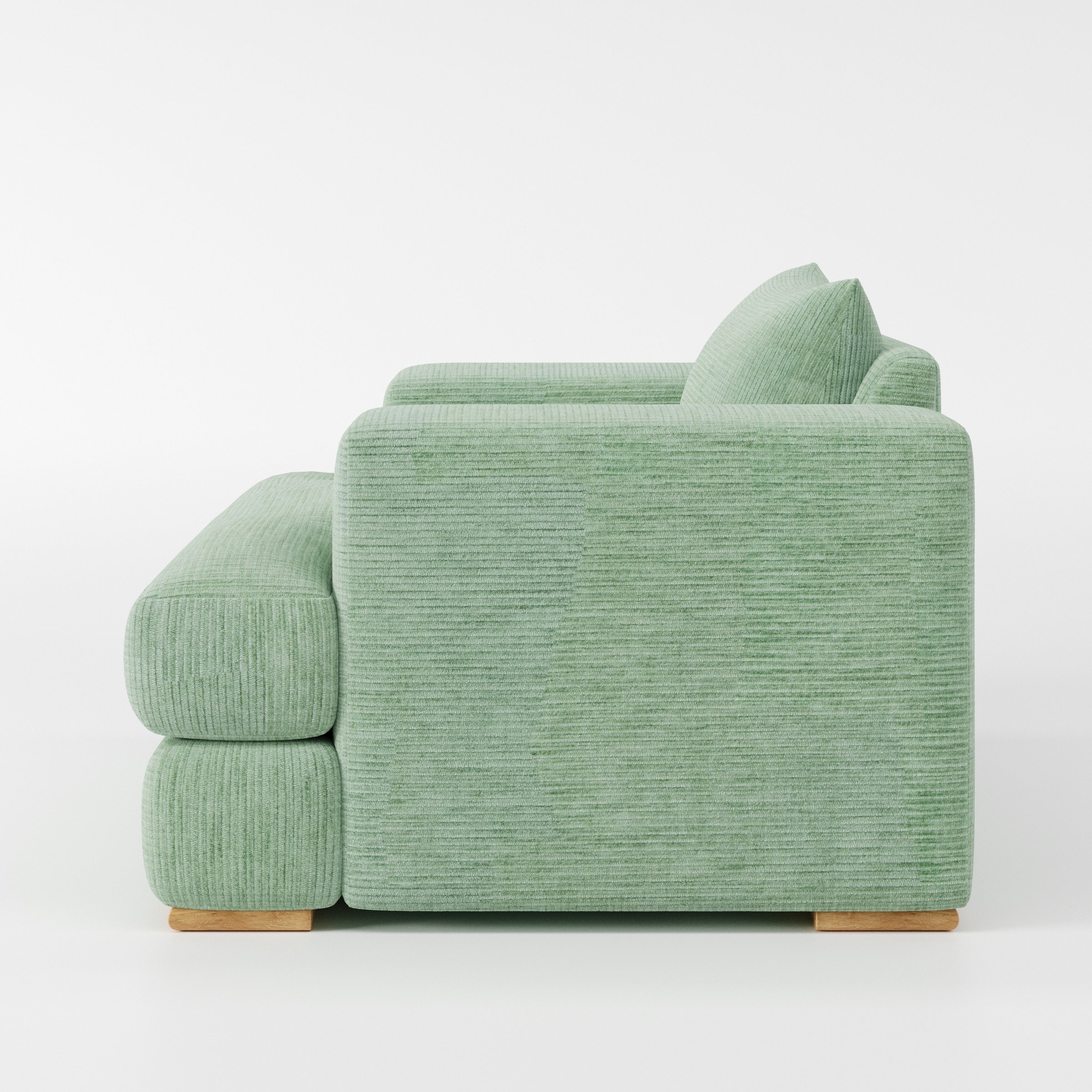 Fane armchair in Caldey Velvet Corduroy Eucalyptus shown in side profile displaying proportions and overall silhouette.