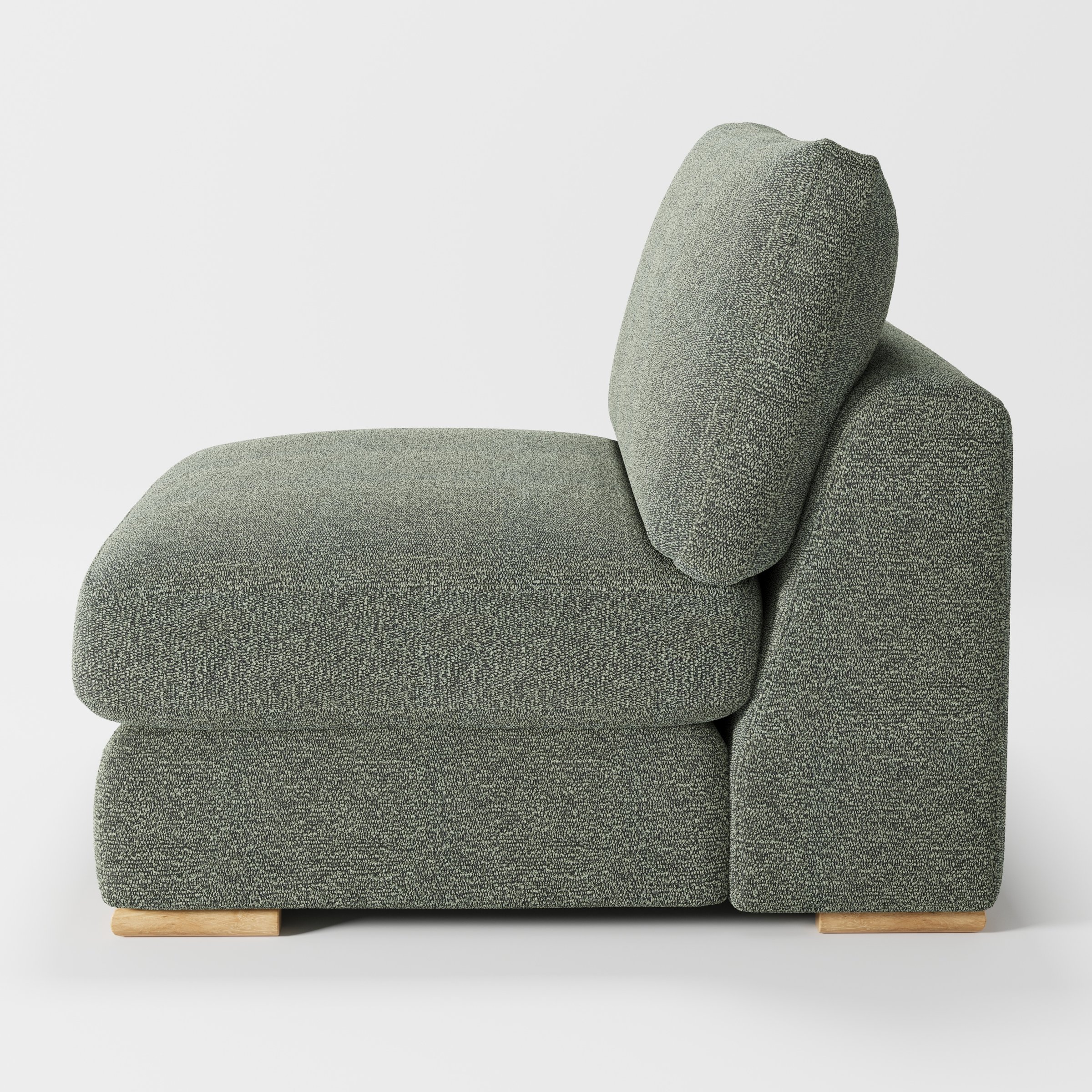 Olton single sofa unit in Kilda Bouclé Moss shown from the side showing the layered seat cushion and angled back cushion with timber feet.