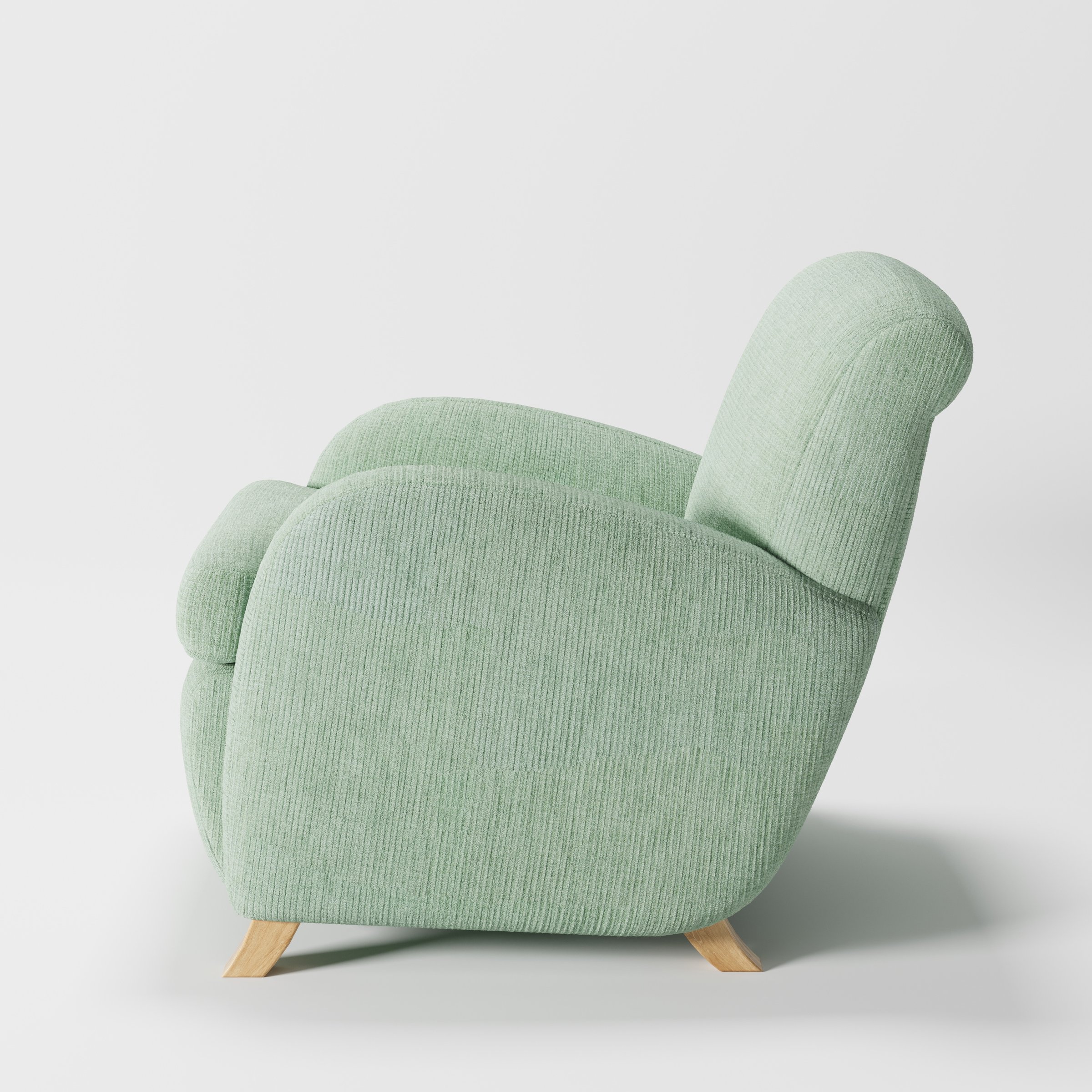 Rye armchair in Caldey Velvet Corduroy Eucalyptus shown in side profile displaying proportions and overall silhouette.