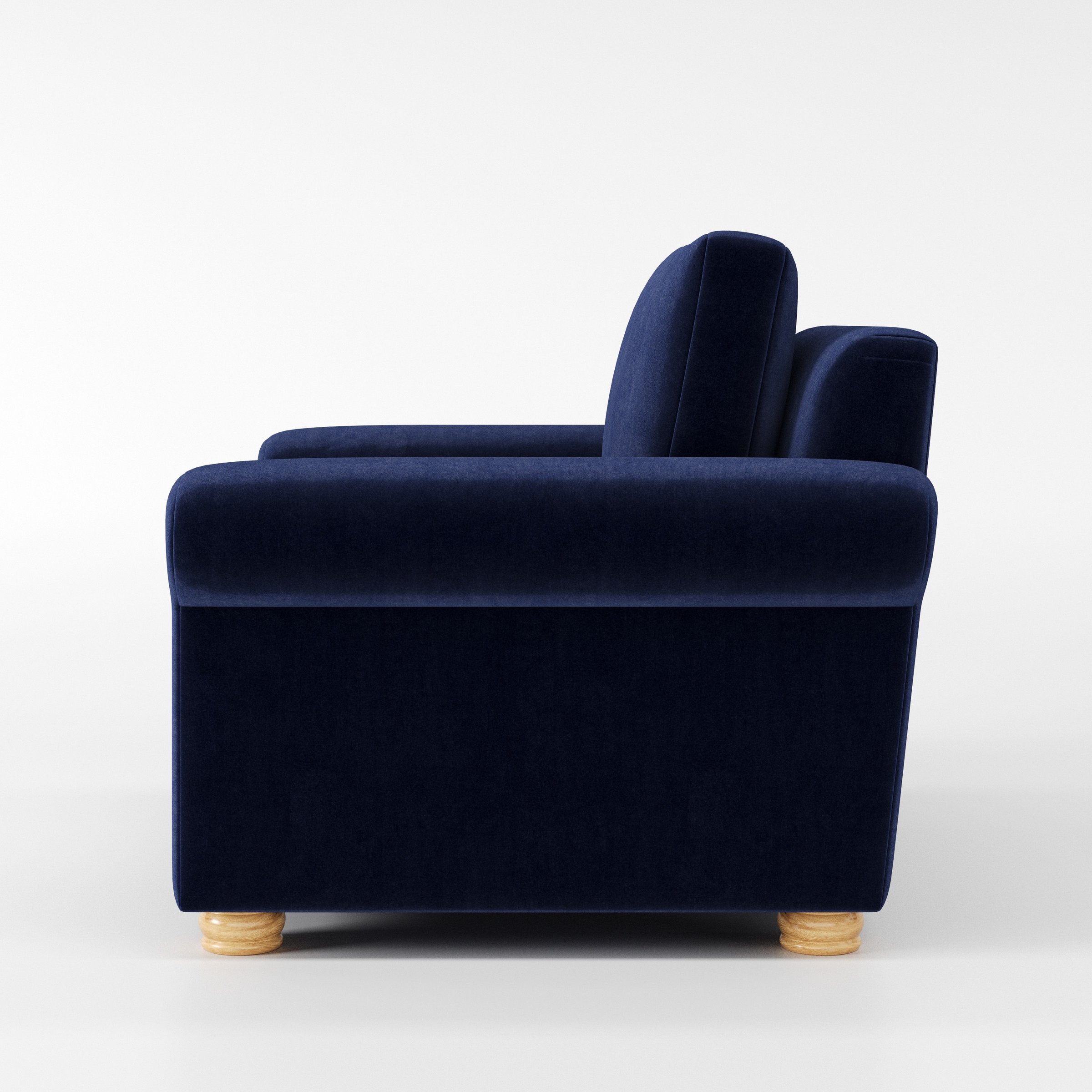 Anna Lee armchair in Noss Velvet Navy shown in side profile displaying proportions and overall silhouette.