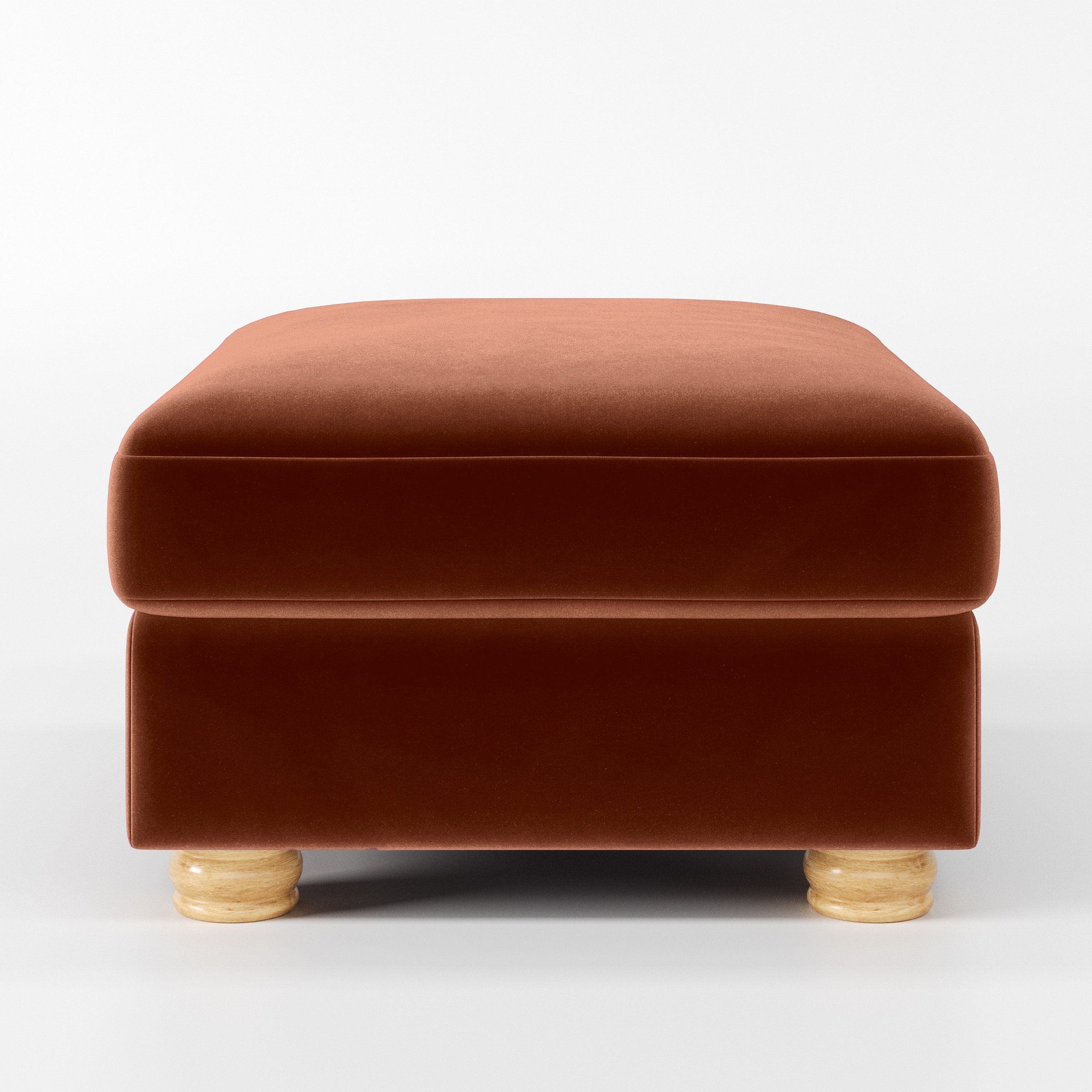 Front view of the Anna Lee footstool upholstered in Plush EasyClean Velvet in Apricot.