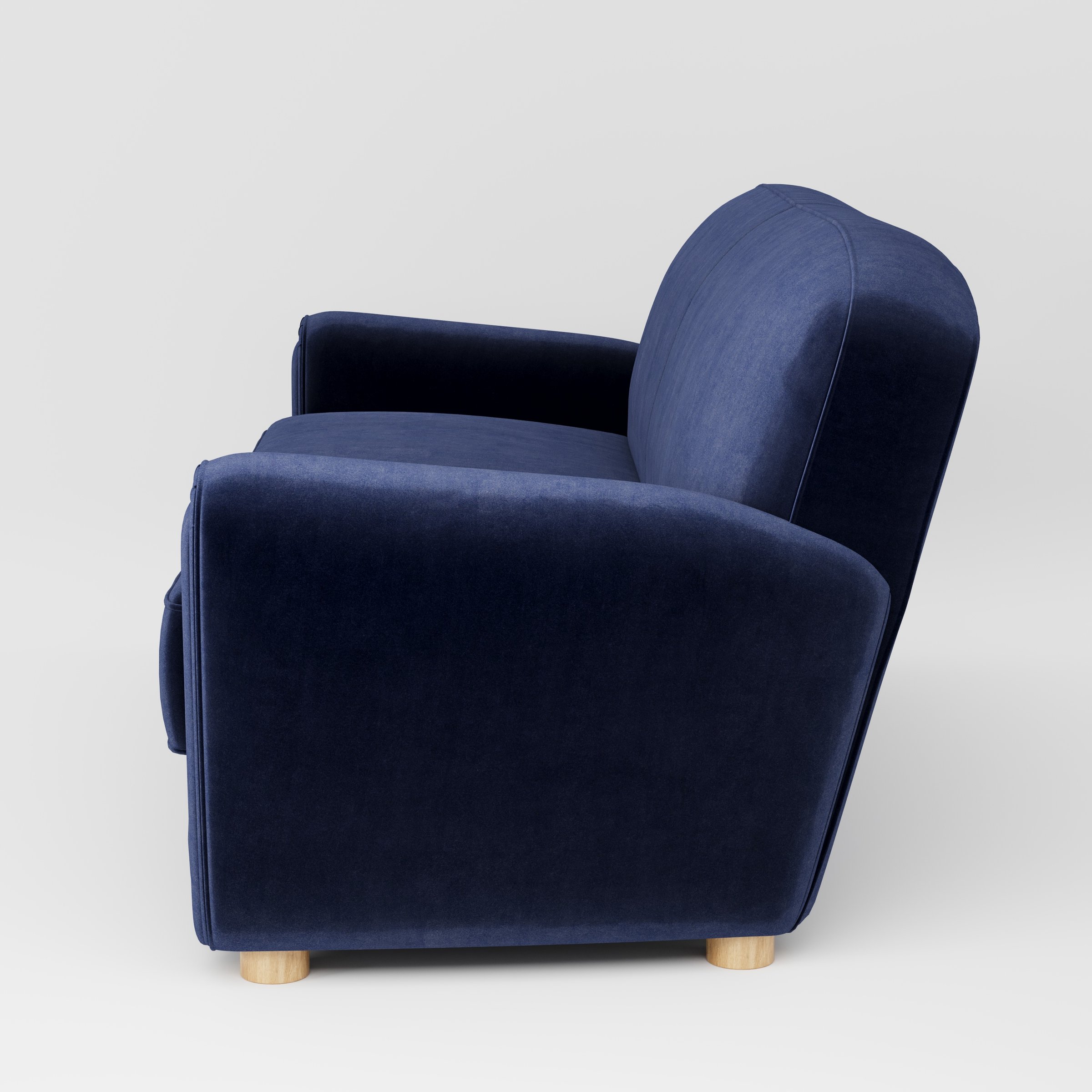 Fergus sofa in Noss Velvet Navy shown in side profile displaying proportions and overall silhouette.