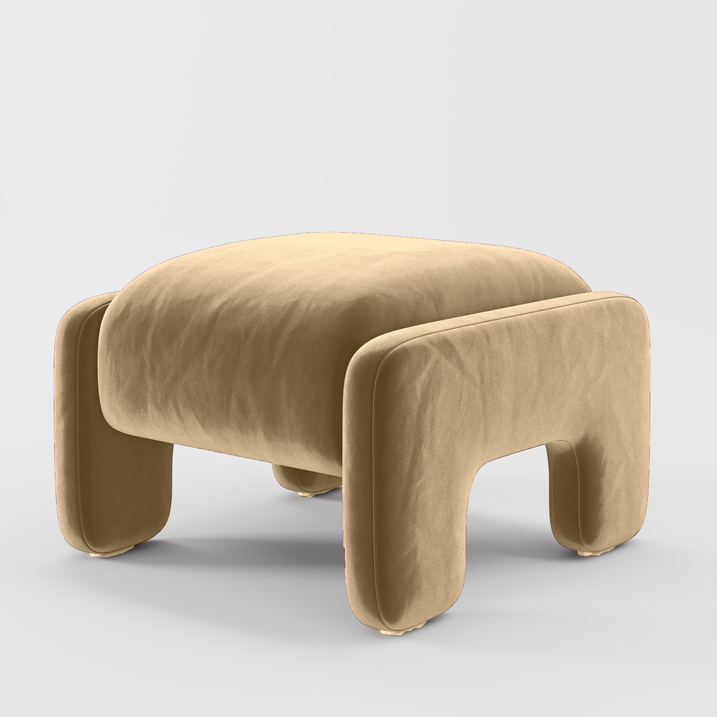 Diagonal view of the Inny footstool upholstered in Plush EasyClean Velvet in Cafe.