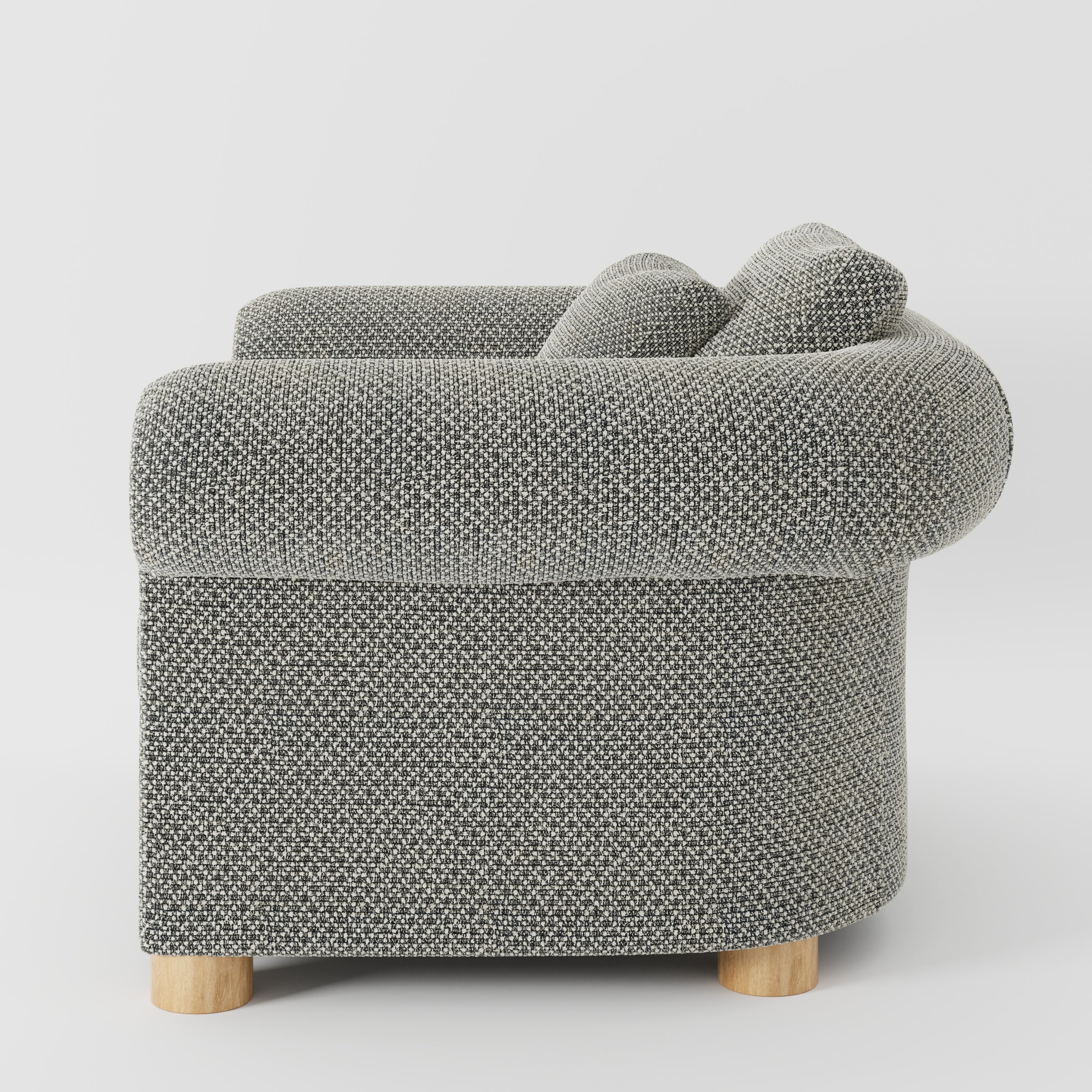 Windermere armchair in Rousay Wool Blend Tar and Chalk shown in side profile displaying proportions and overall silhouette.