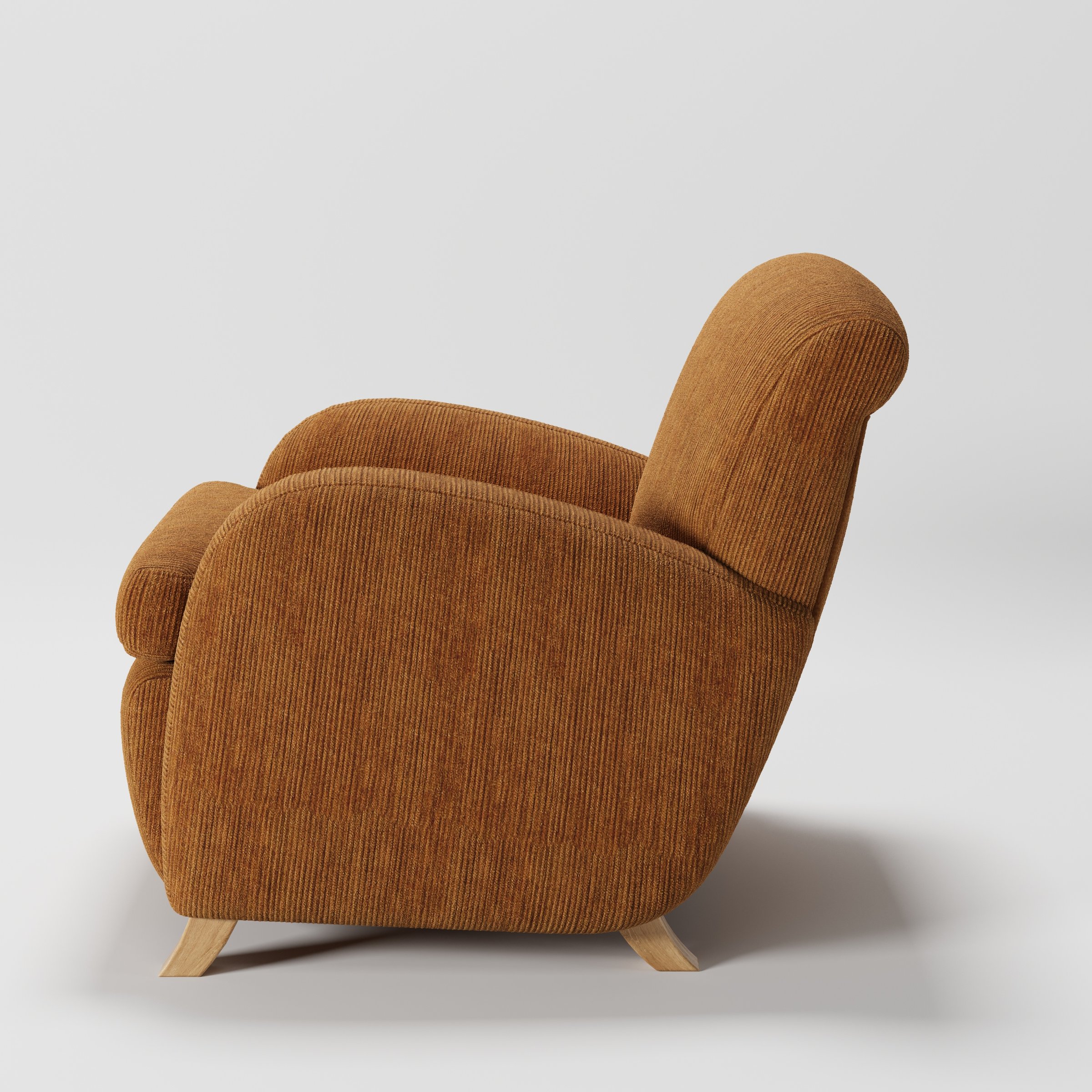 Rye armchair in Caldey Velvet Corduroy Tobacco shown in side profile displaying proportions and overall silhouette.