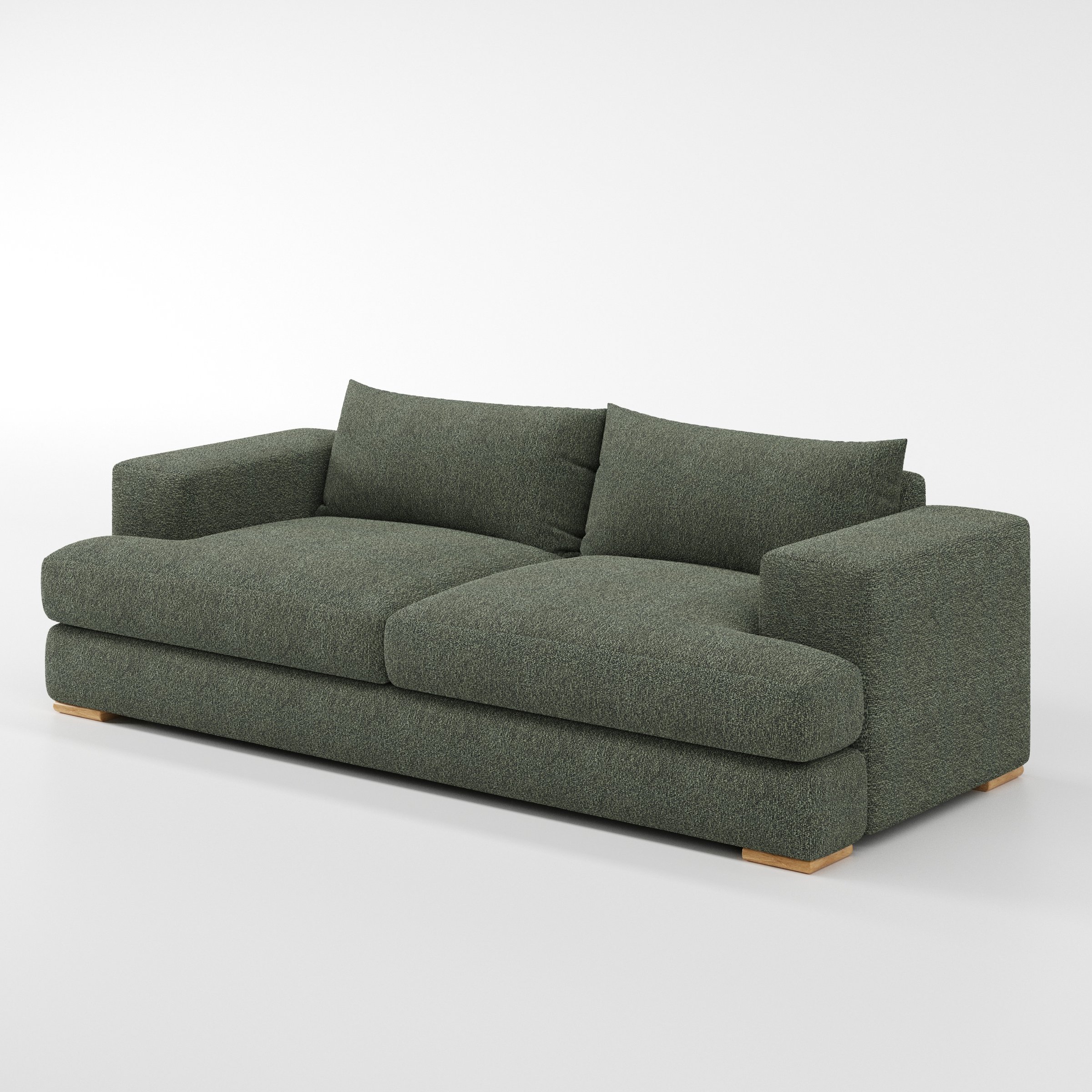 Fane sofa in Kilda Boucle Moss shown at a diagonal angle highlighting arm profile and seat depth.