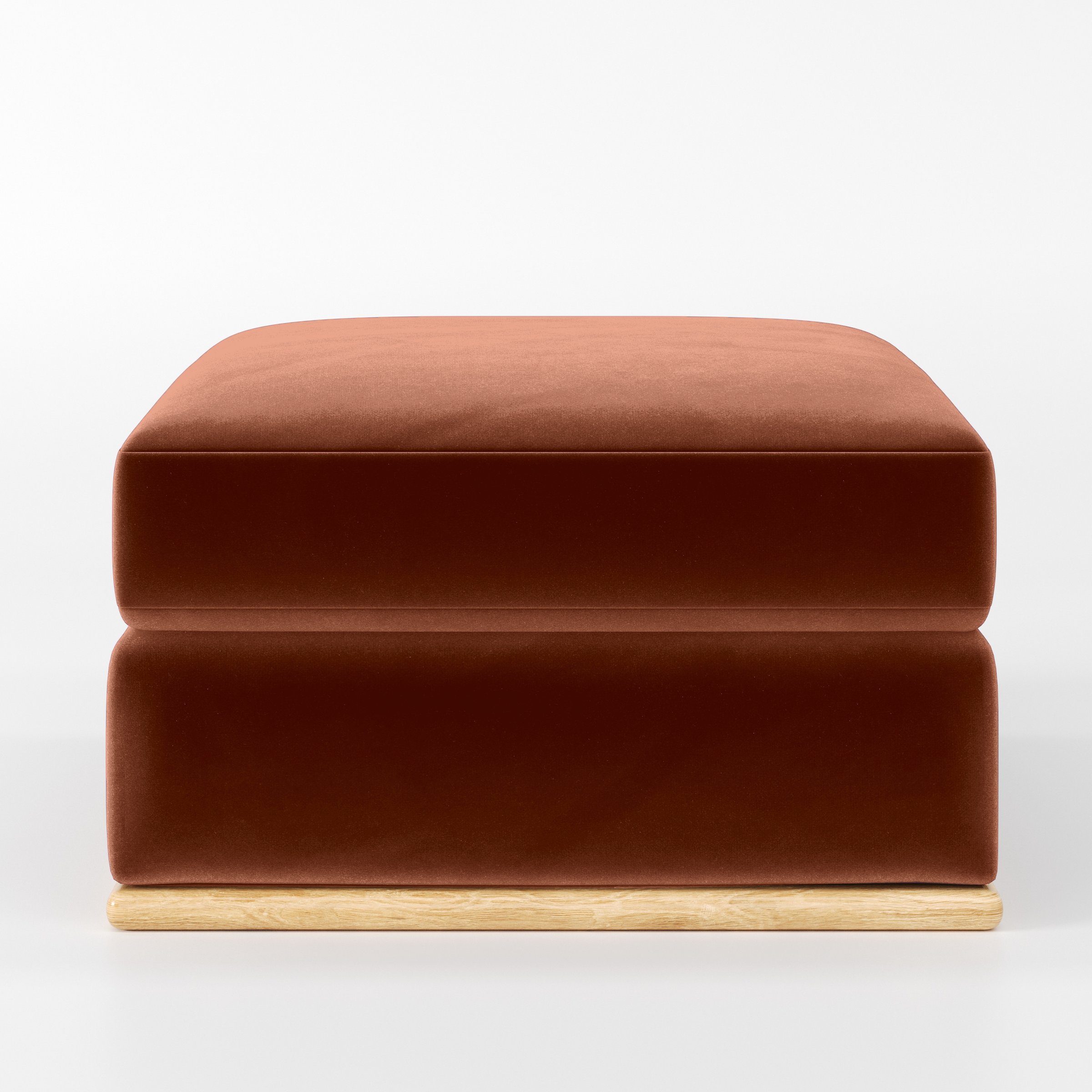 Front view of the Cusher footstool upholstered in Plush EasyClean Velvet in Apricot.