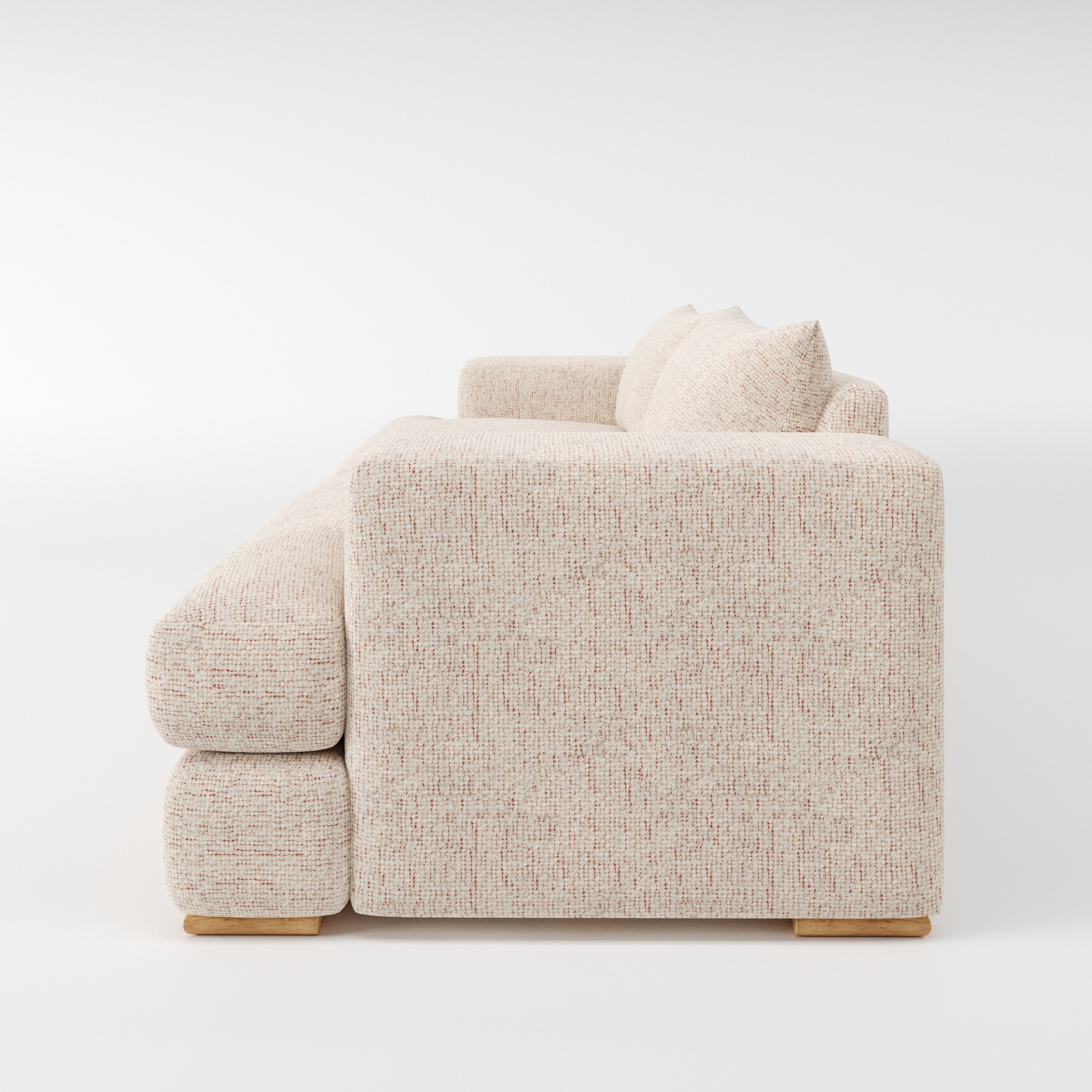 Fane sofa in Orsay Boucle Cream and Copper shown in side profile displaying proportions and overall silhouette.