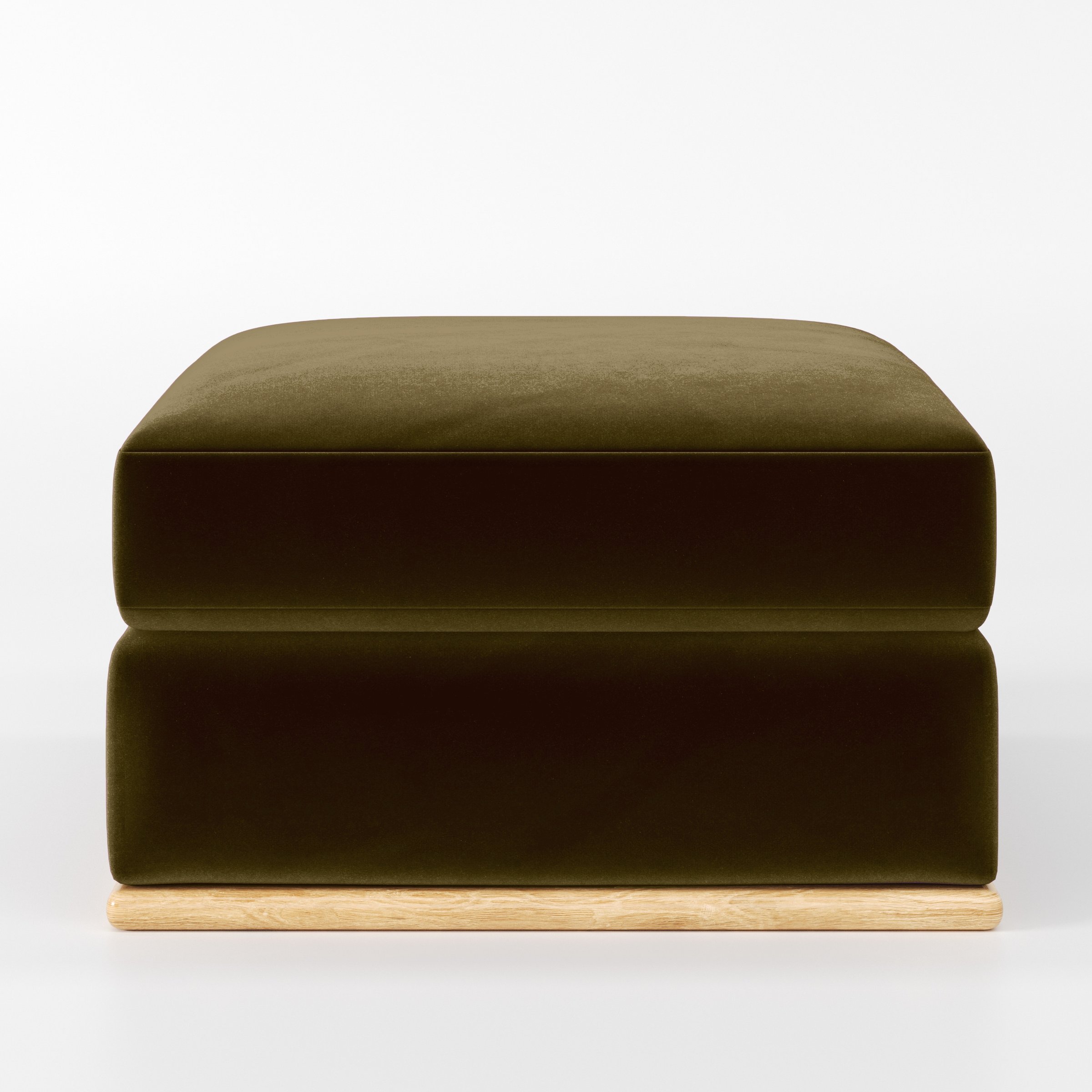 Front view of the Cusher footstool upholstered in Plush EasyClean Velvet in Cedar.