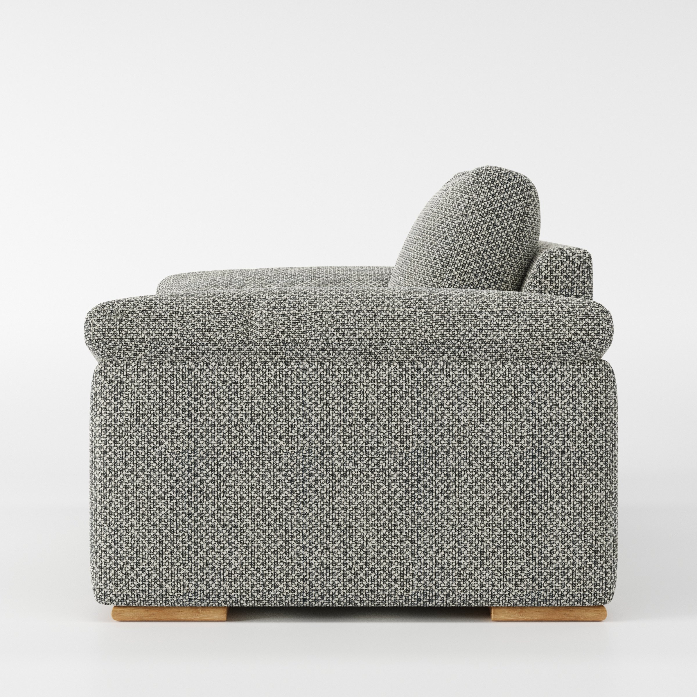 Moy armchair in Rousay Wool Blend Tar and Chalk shown in side profile displaying proportions and overall silhouette.