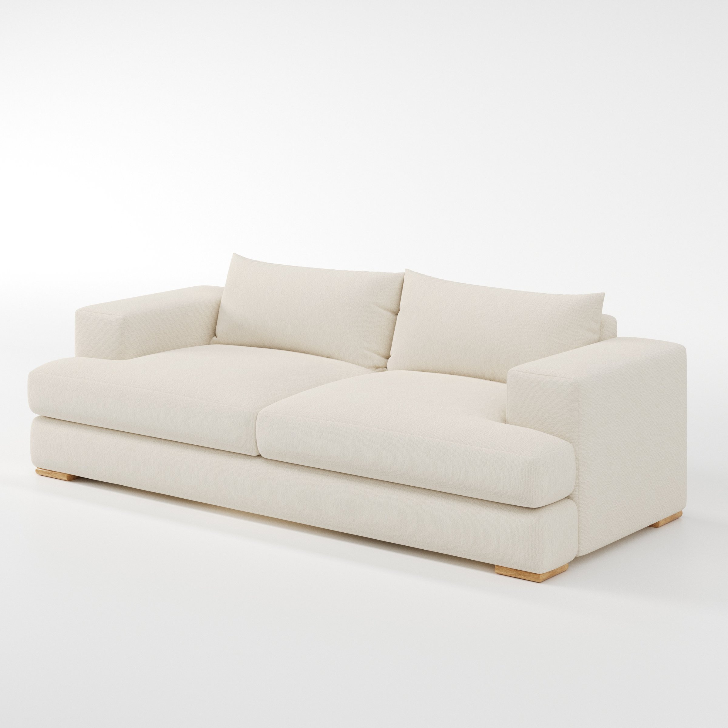 Fane sofa in Kilda Boucle Cream shown at a diagonal angle highlighting arm profile and seat depth.