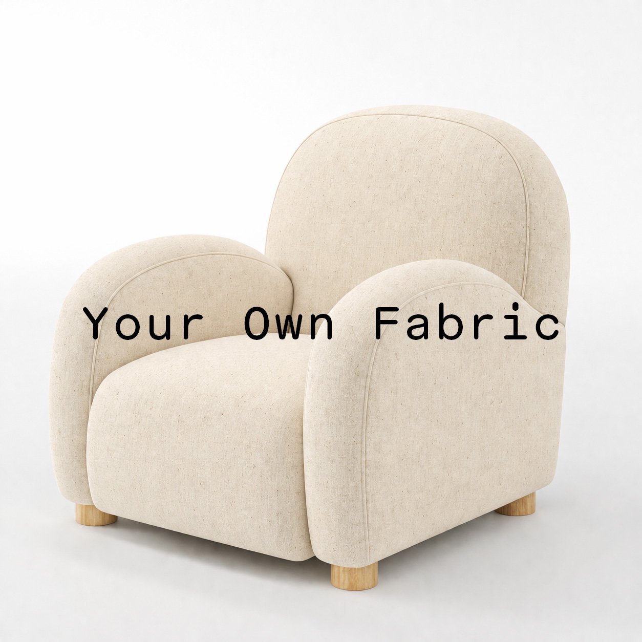 Diagonal view of the Awe armchair upholstered in customers own material calico cotton fabric.