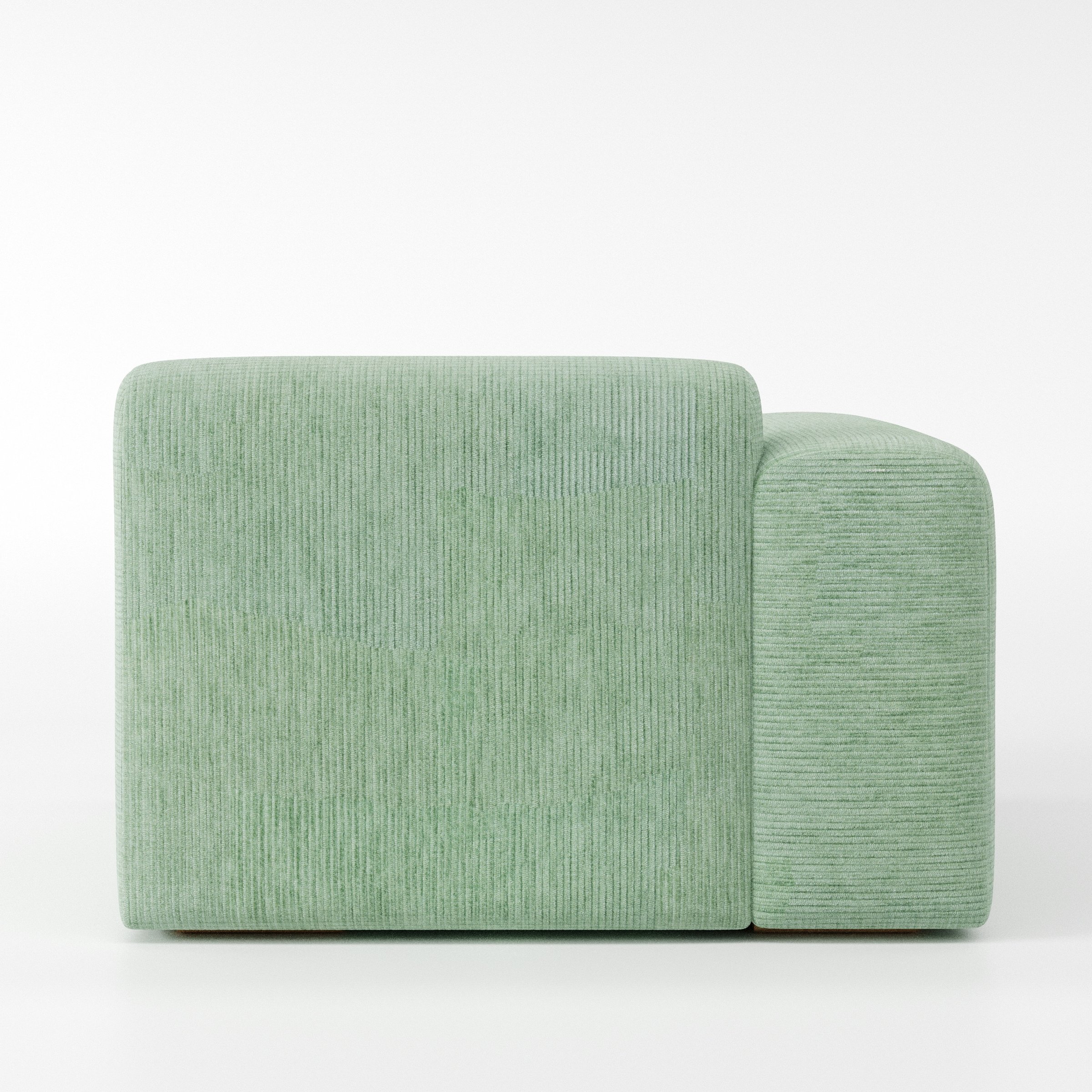 Drumquin modular sofa left side unit in Caldey Velvet Corduroy Eucalyptus shown from the back with a smooth, softly curved silhouette and armrest edge visible.