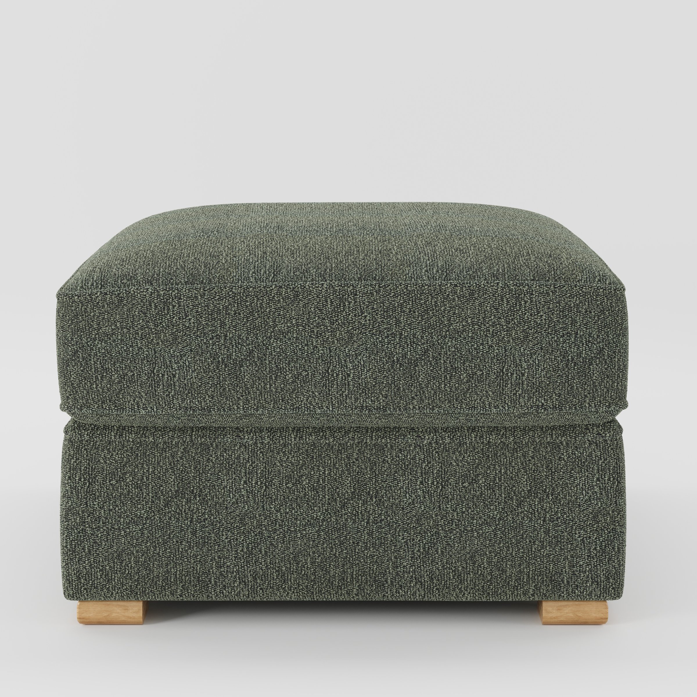Cashel footstool in Kilda Boucle Moss shown front-on against a neutral studio backdrop.