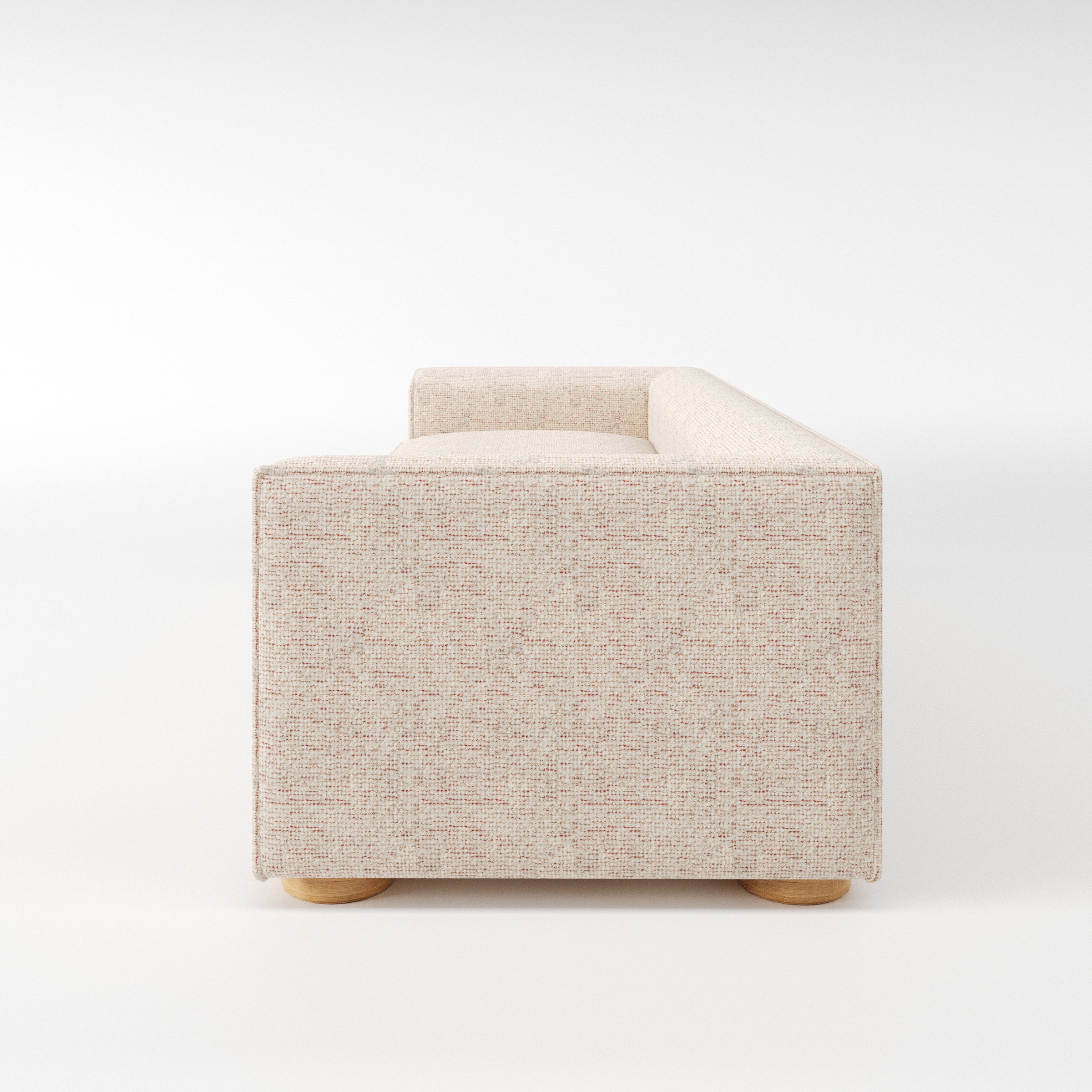 Feale sofa in Orsay Boucle Cream and Copper shown in side profile displaying proportions and overall silhouette.