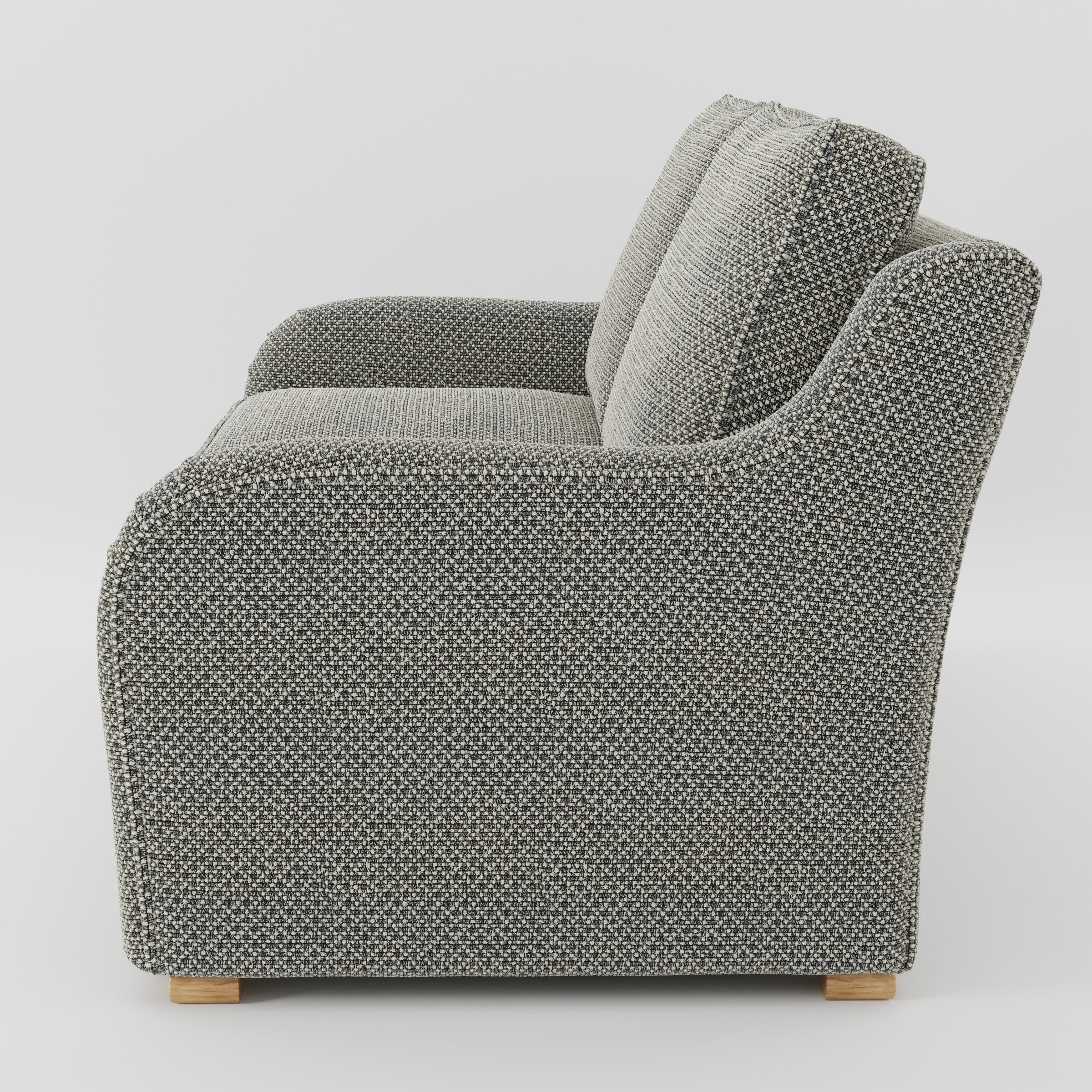Cashel sofa in Rousay Wool Blend Tar and Chalk shown in side profile displaying proportions and overall silhouette.