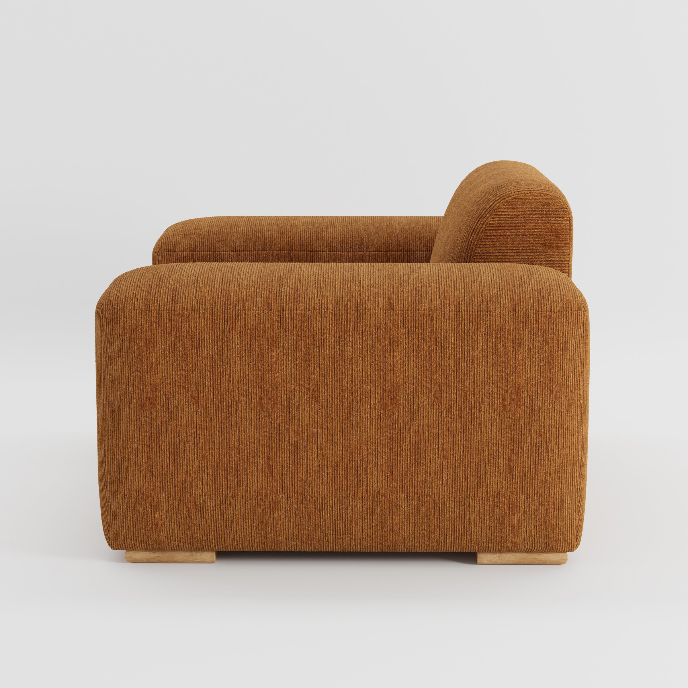 Darwell armchair in Caldey Velvet Corduroy Tobacco shown in side profile displaying proportions and overall silhouette.