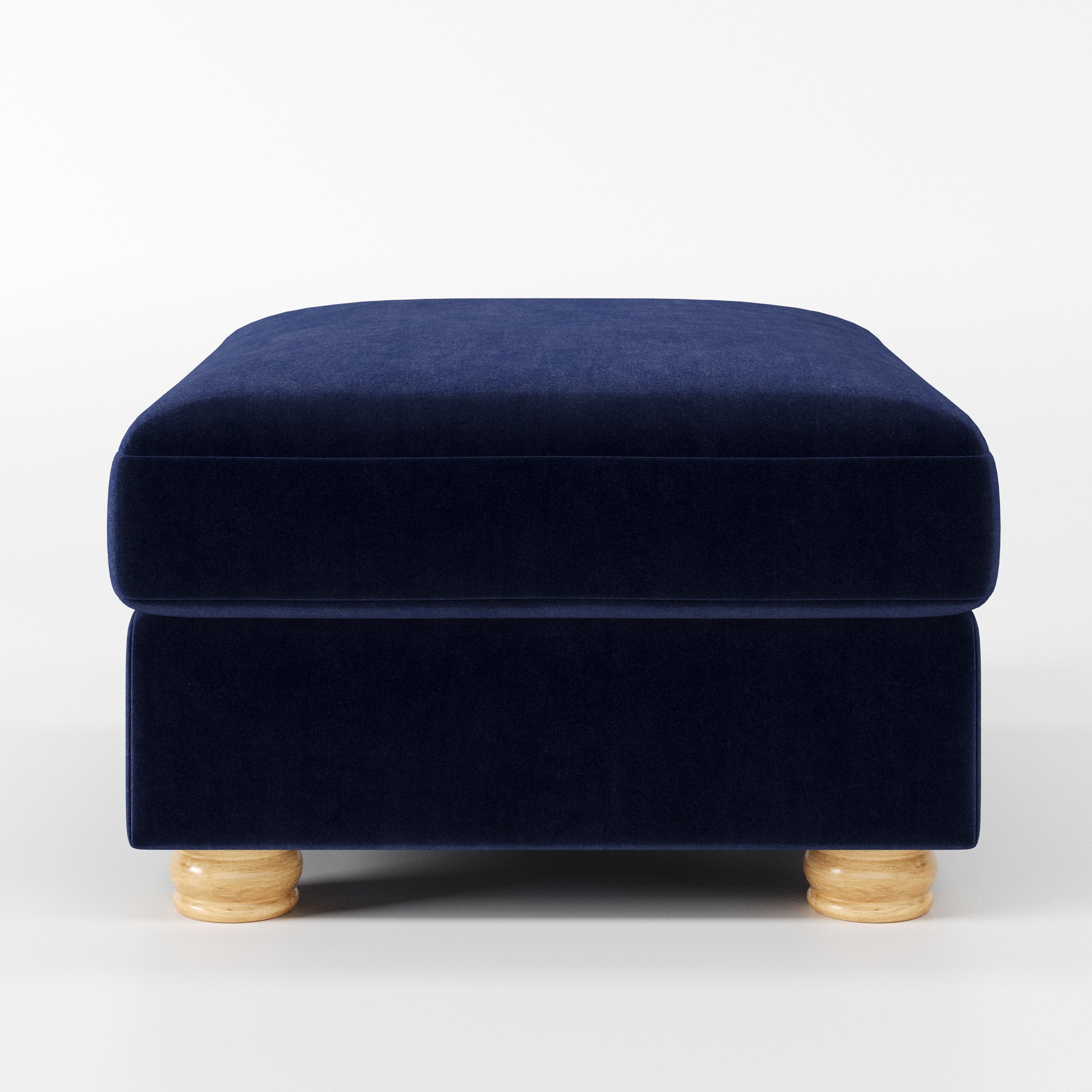 Anna Lee footstool in Noss Velvet Navy shown front-on against a neutral studio backdrop.
