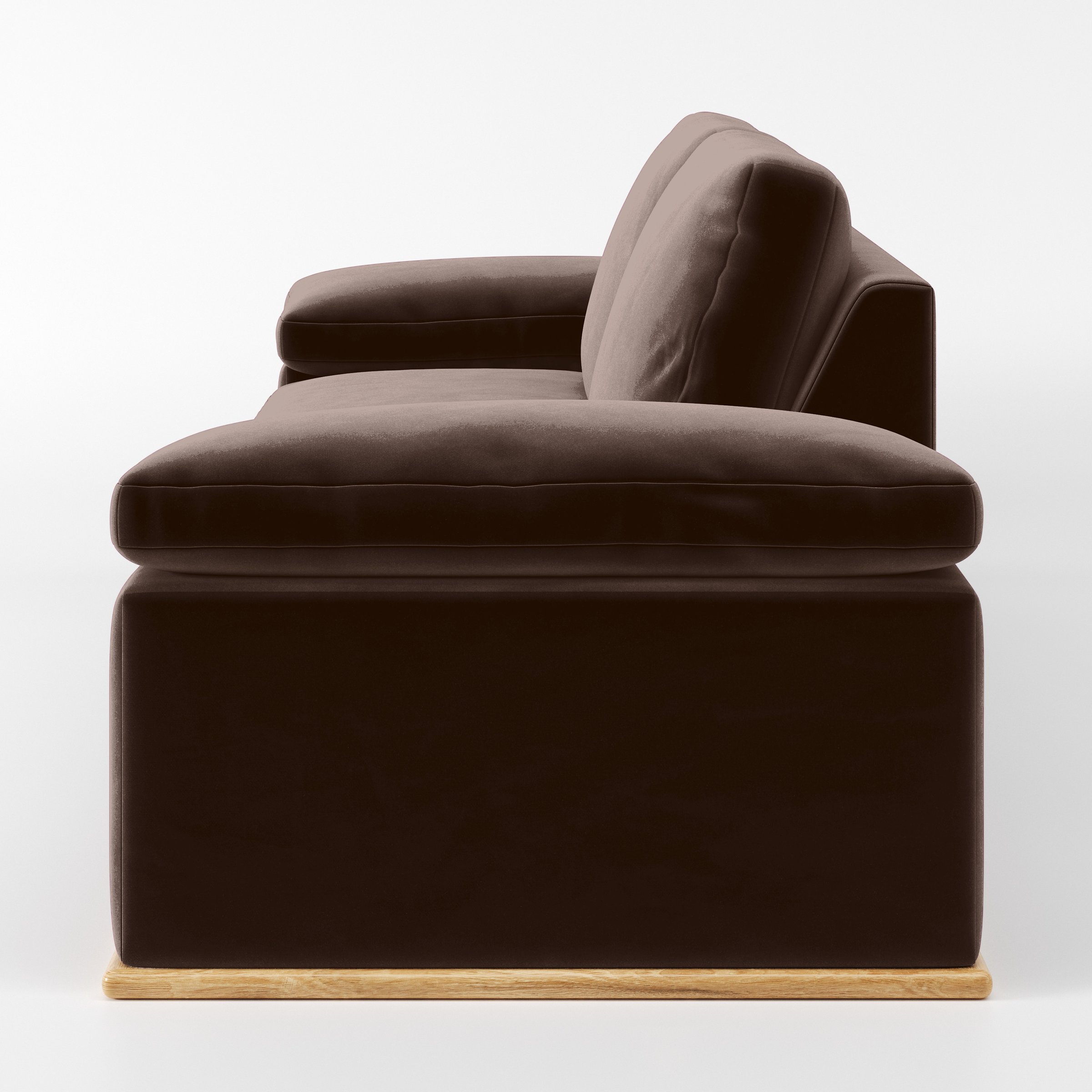 Side view of the Cusher sofa upholstered in Plush EasyClean Velvet in Mole.