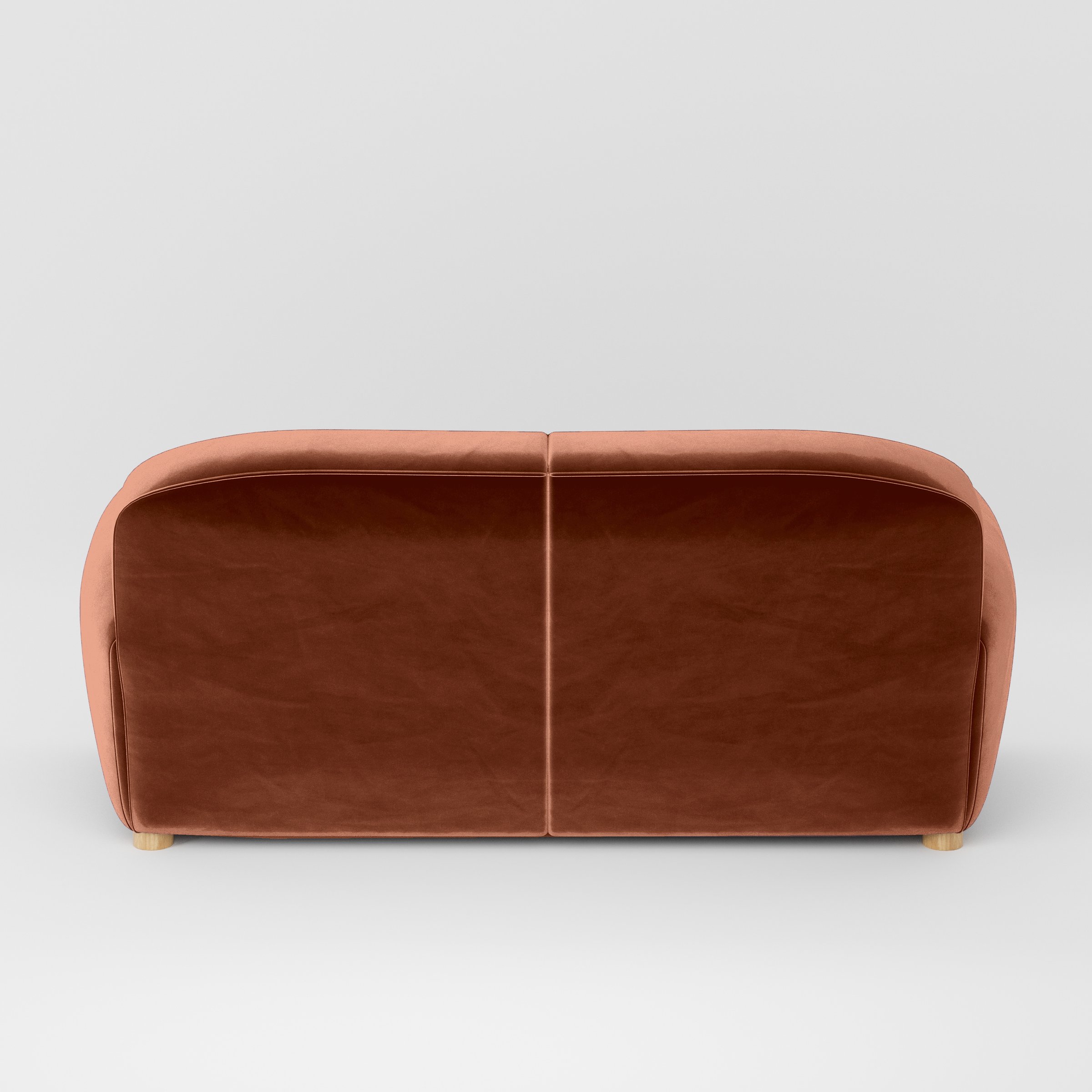 Rear view of the Fergus sofa upholstered in Plush EasyClean Velvet in Apricot.
