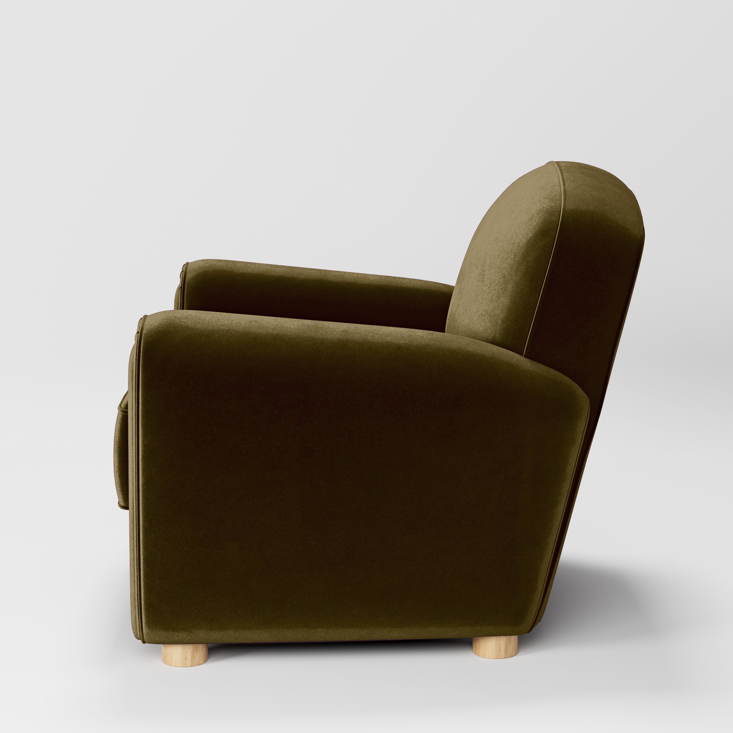 Side view of the Fergus armchair upholstered in Plush EasyClean Velvet in Cedar.