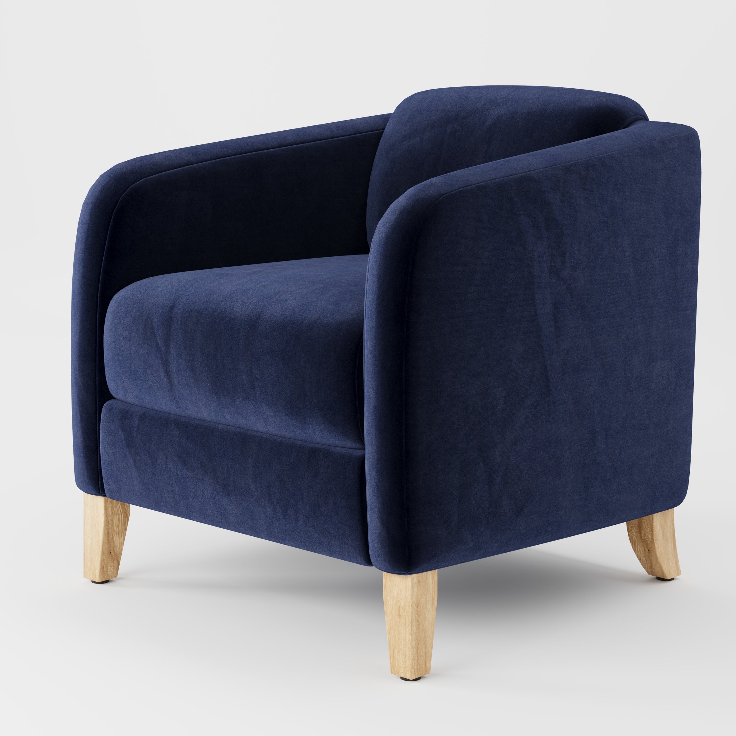 Erne armchair in Noss Velvet Navy shown at a diagonal angle highlighting curved arms and compact seat depth.