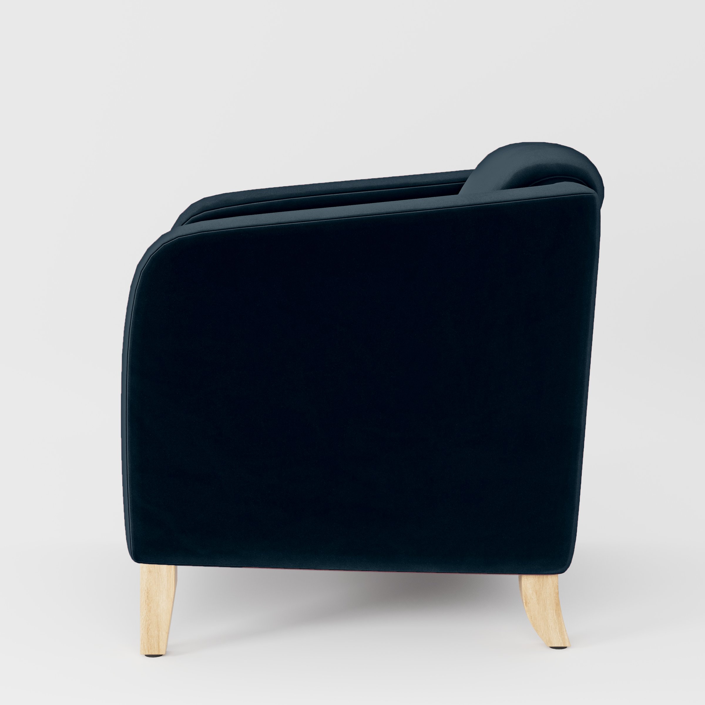 Side view of the Erne armchair upholstered in Plush EasyClean Velvet in Navy.