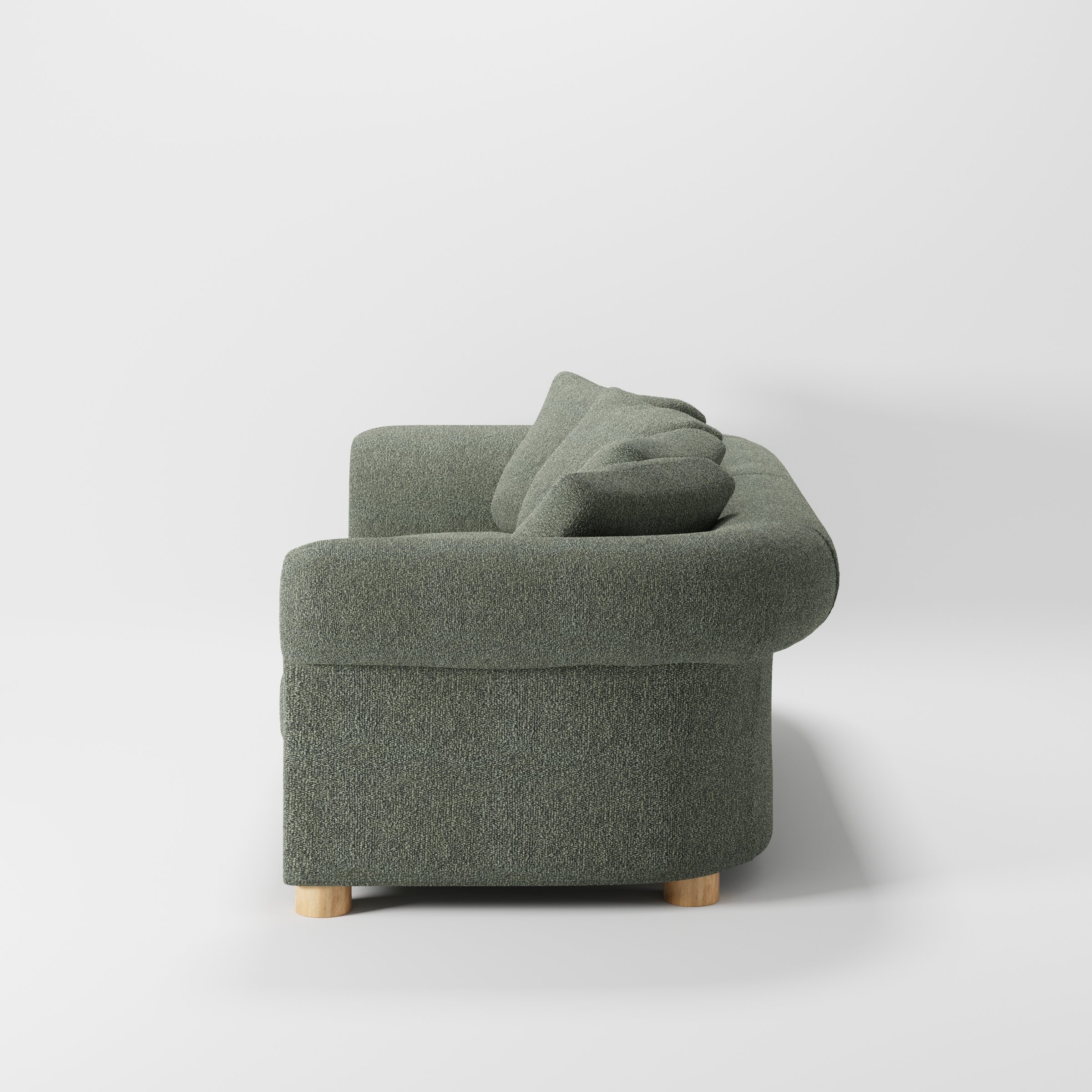 Windermere sofa in Kilda Boucle Moss shown in side profile displaying proportions and overall silhouette.