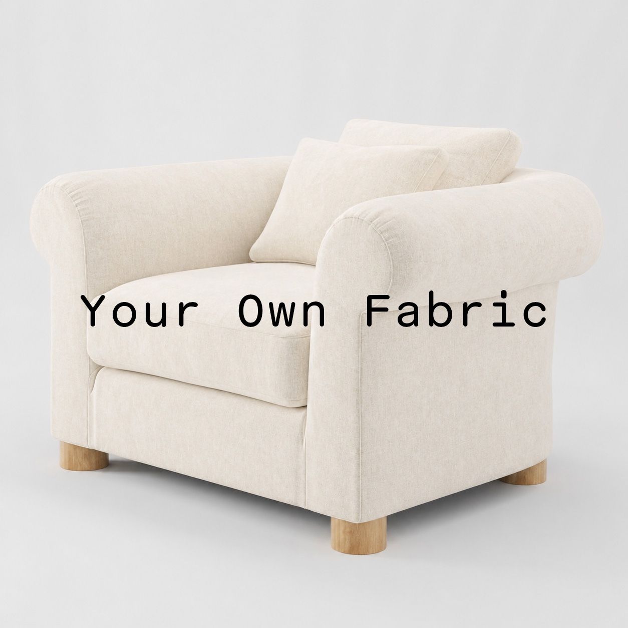 Diagonal view of the Windermere armchair upholstered in customers own material calico cotton fabric.