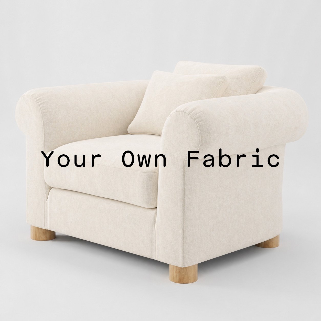 Diagonal view of the Windermere armchair upholstered in customers own material calico cotton fabric.