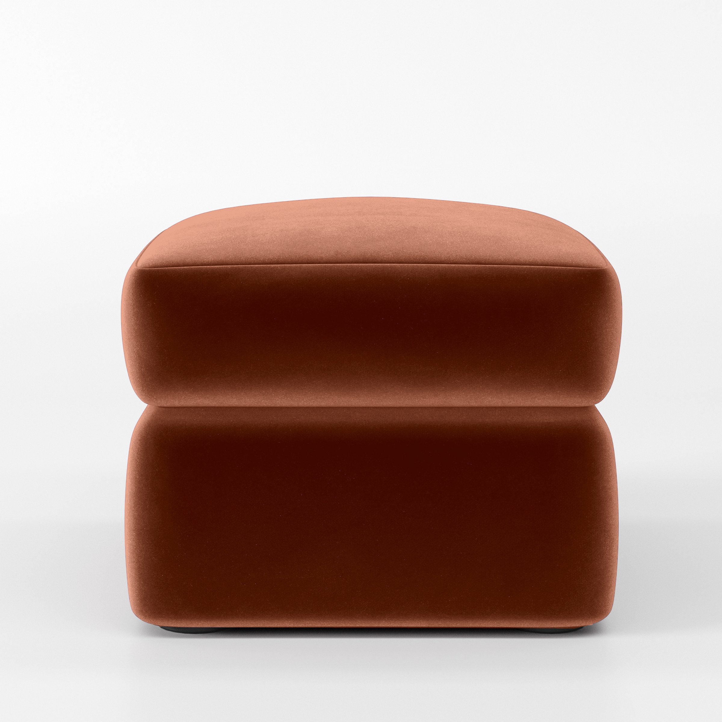 Front view of the Coniston footstool upholstered in Plush EasyClean Velvet in Apricot.