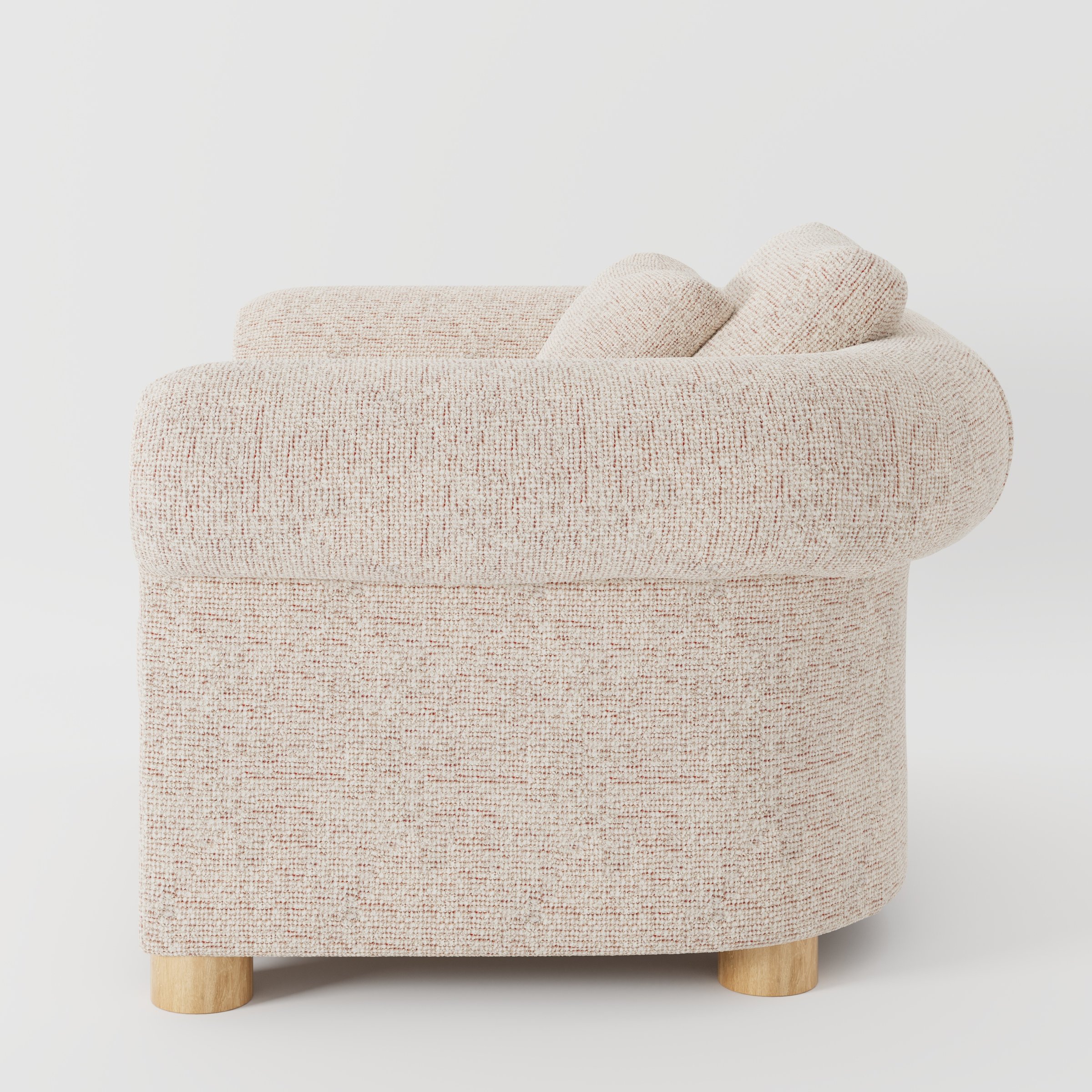 Windermere armchair in Orsay Boucle Cream and Copper shown in side profile displaying proportions and overall silhouette.