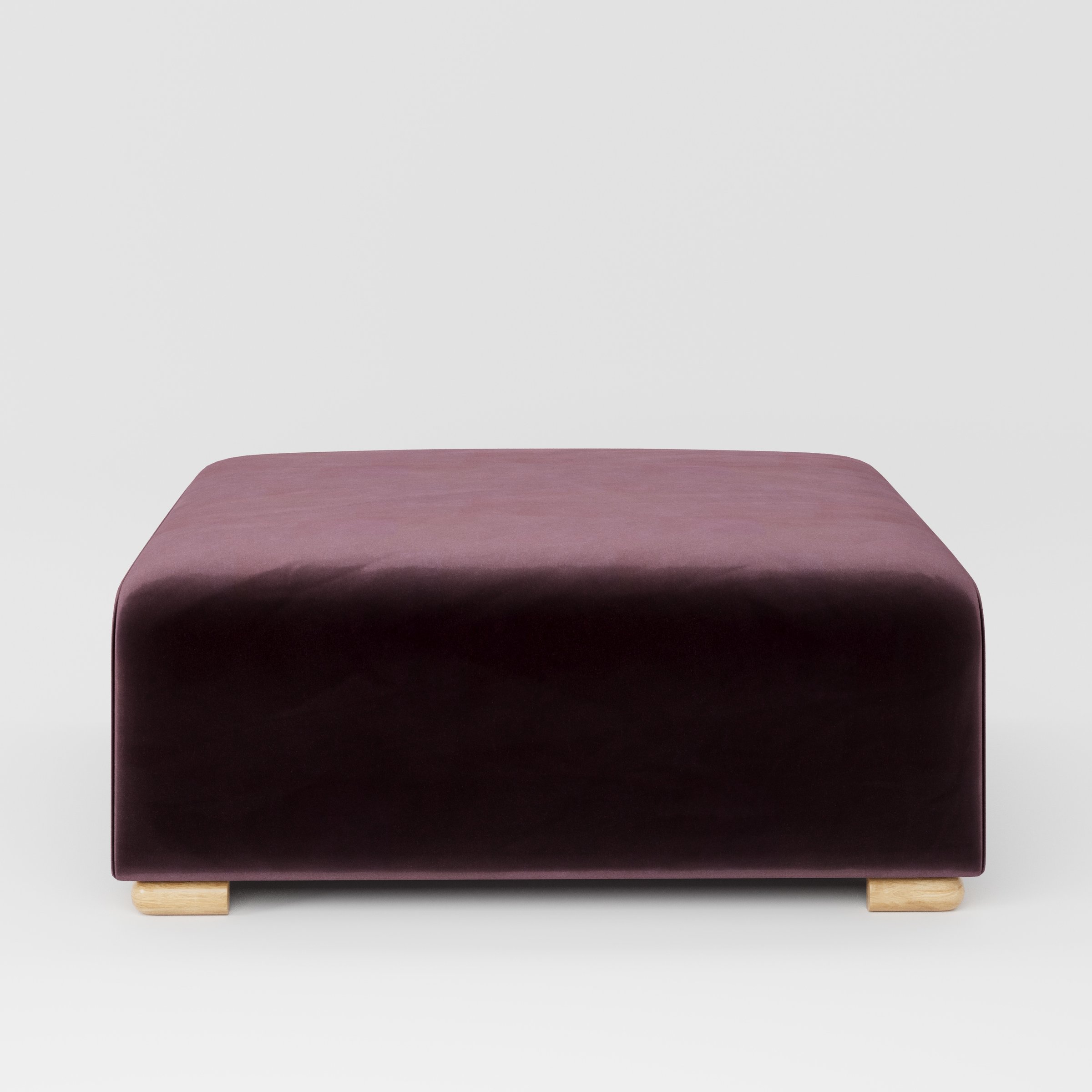 Tay footstool in Noss Velvet Plum shown front-on against a neutral studio backdrop.