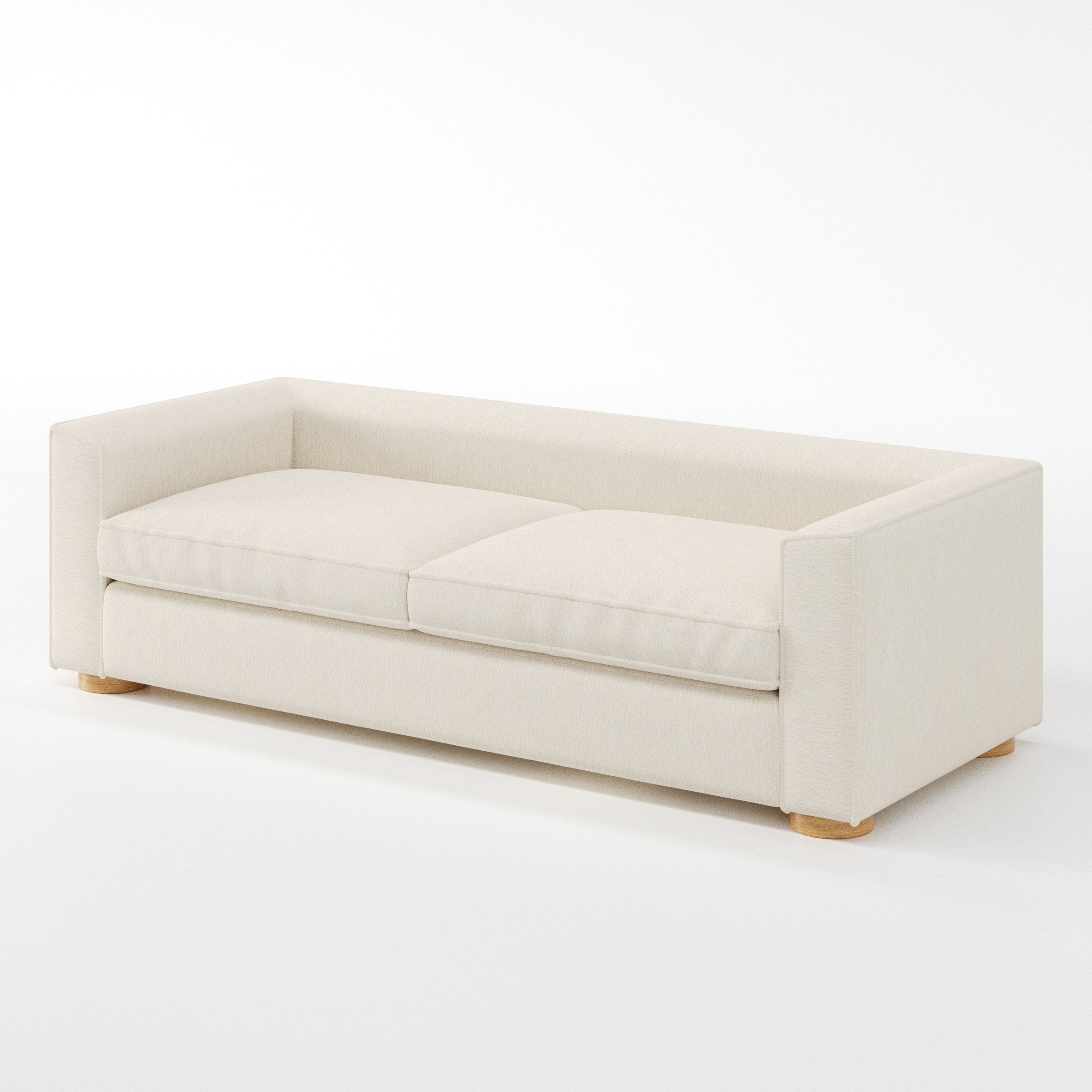 Feale sofa in Kilda Boucle Cream shown at a diagonal angle highlighting arm profile and seat depth.